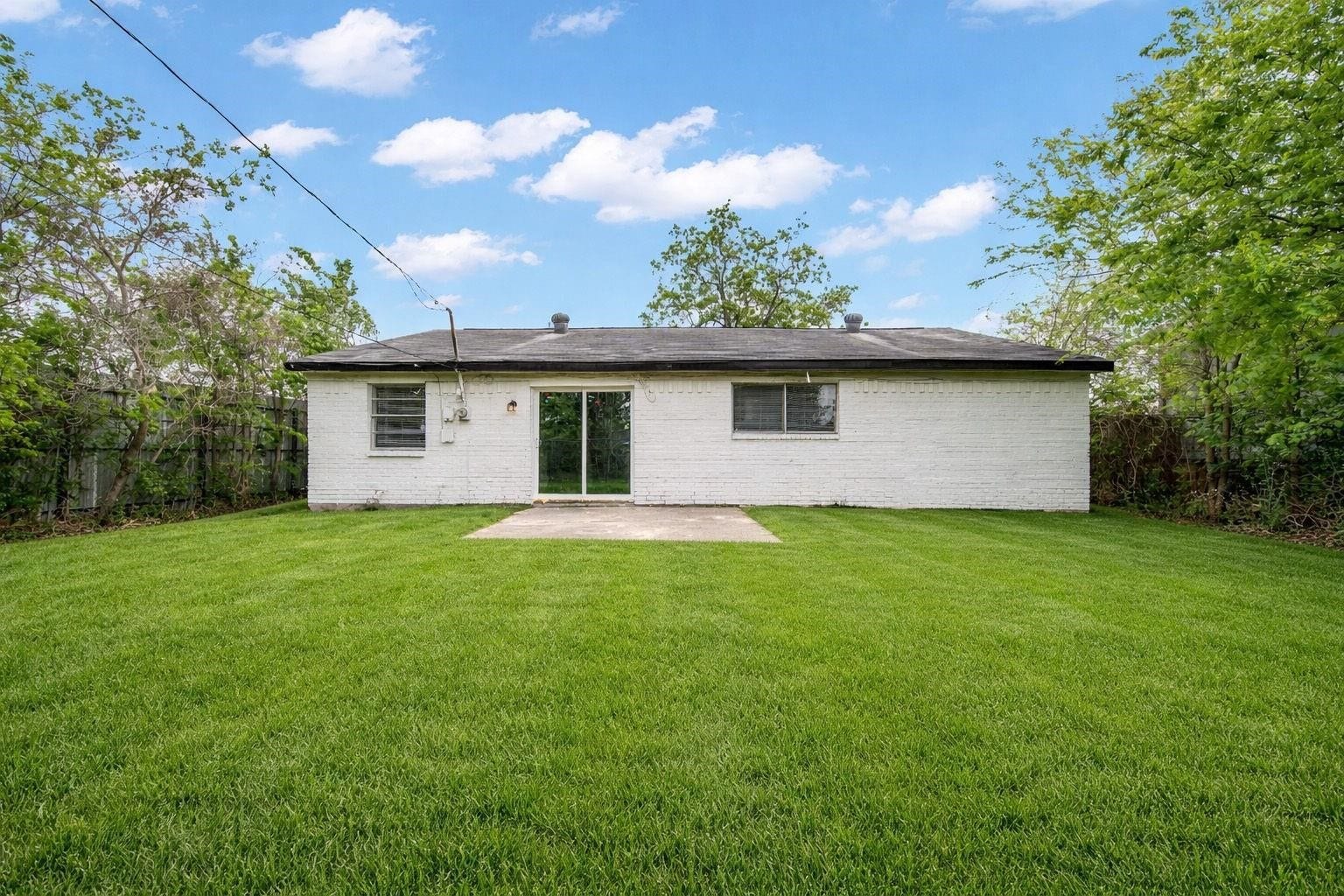 10902 Jutland Road, Houston, TX 77048 The concrete back patio provides an inviting outdoor setting, ideal for alfresco dining, weekend grilling or enjoying a peaceful morning surrounded by the comforts of your own backyard.