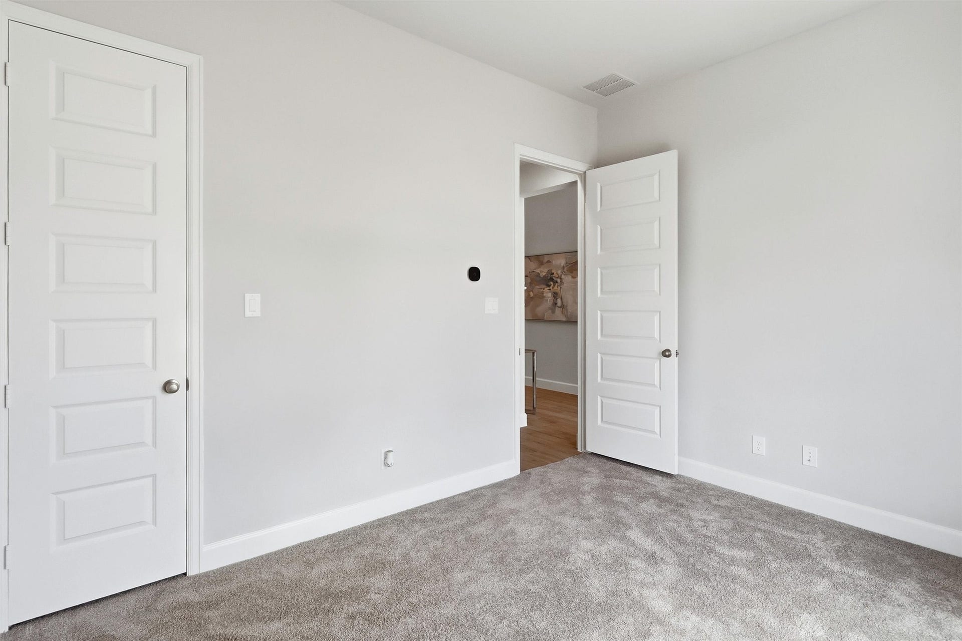 30135 Gold Finch Place, Fulshear, TX 77441 Another view highlights the room's flexible layout, spacious proportions, and convenient access to the nearby hall bath. A large closet provides ample storage while maintaining a clean, uncluttered feel.