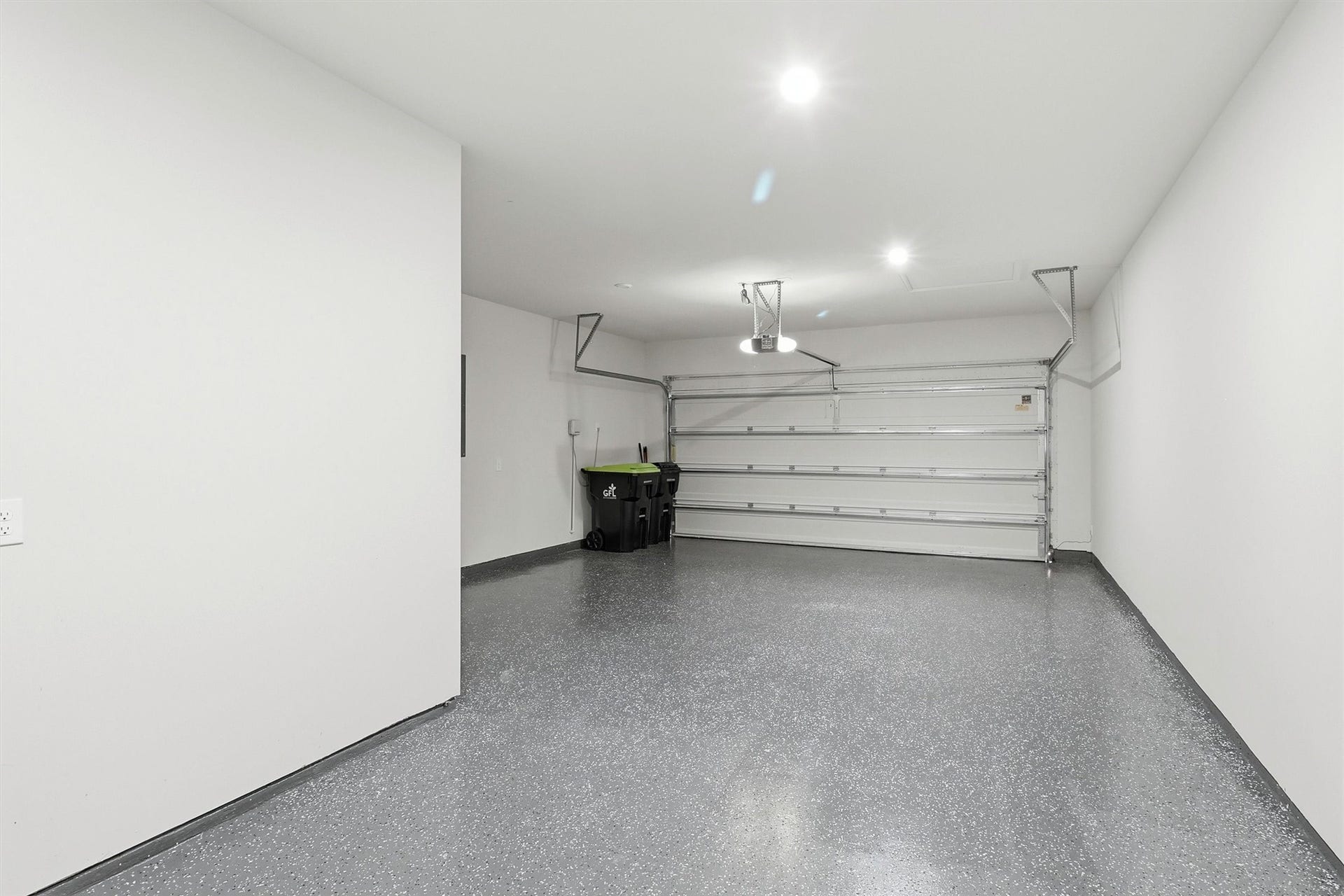 30135 Gold Finch Place, Fulshear, TX 77441 The attached three-car garage offers abundant space for vehicles, storage, and hobbies. An epoxy-coated floor provides a durable, low-maintenance finish while the automatic garage door opener adds everyday convenience.