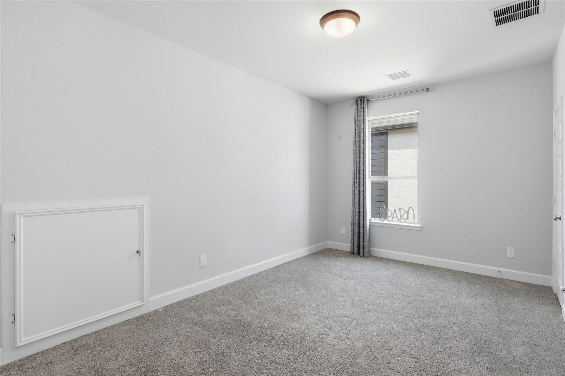 30135 Gold Finch Place, Fulshear, TX 77441 This secondary bedroom offers plush carpeting, soft natural light, and a spacious layout that easily accommodates a full bedroom suite. Neutral finishes provide the perfect backdrop for any style.