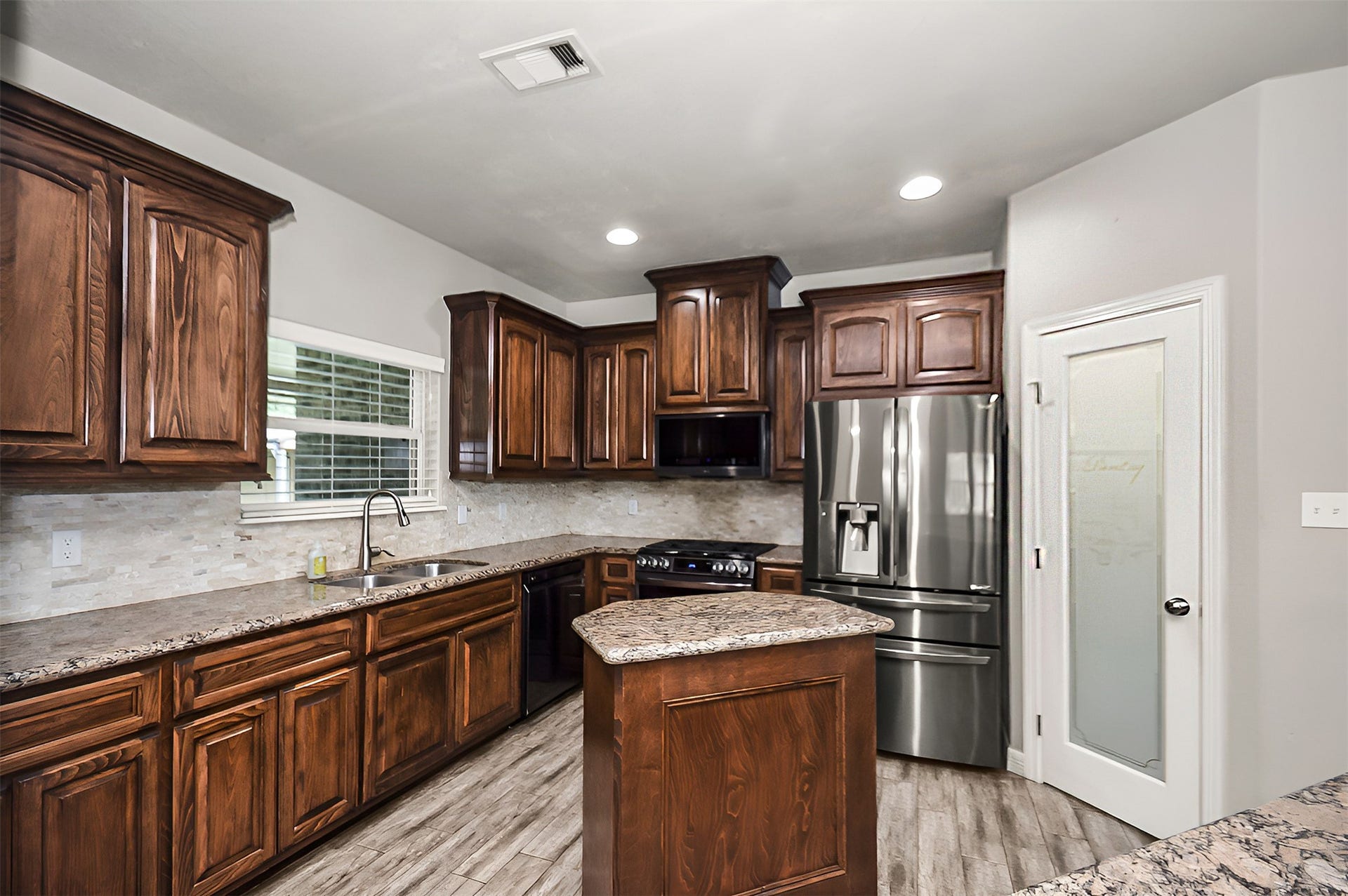 Open kitchen with plenty of counter space and cabinet storage
