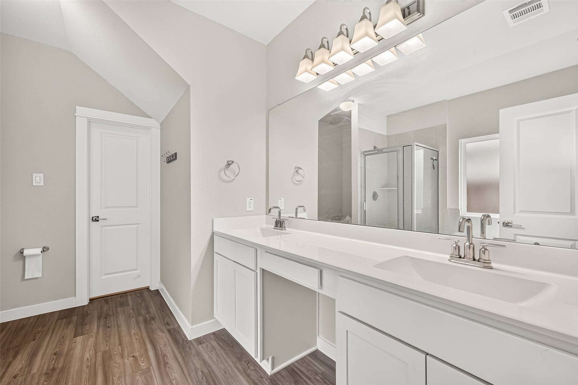32922 Ruthie Dean Drive, Fulshear, TX 77423 The primary bathroom features a double-sink vanity, generous counter space, and storage below.
