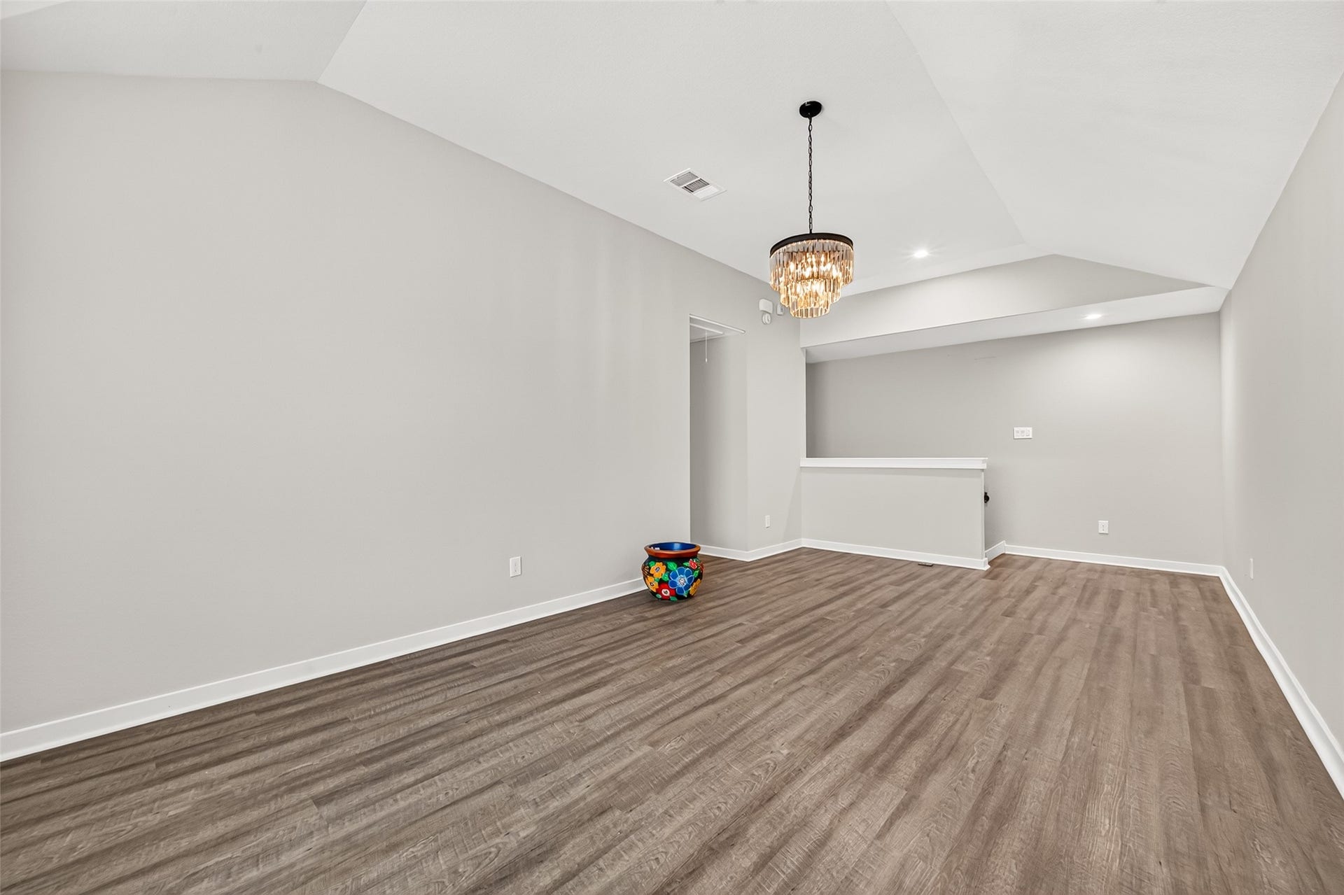 32922 Ruthie Dean Drive, Fulshear, TX 77423 This reverse view highlights the game rooms generous layout and continuous wood-look flooring.