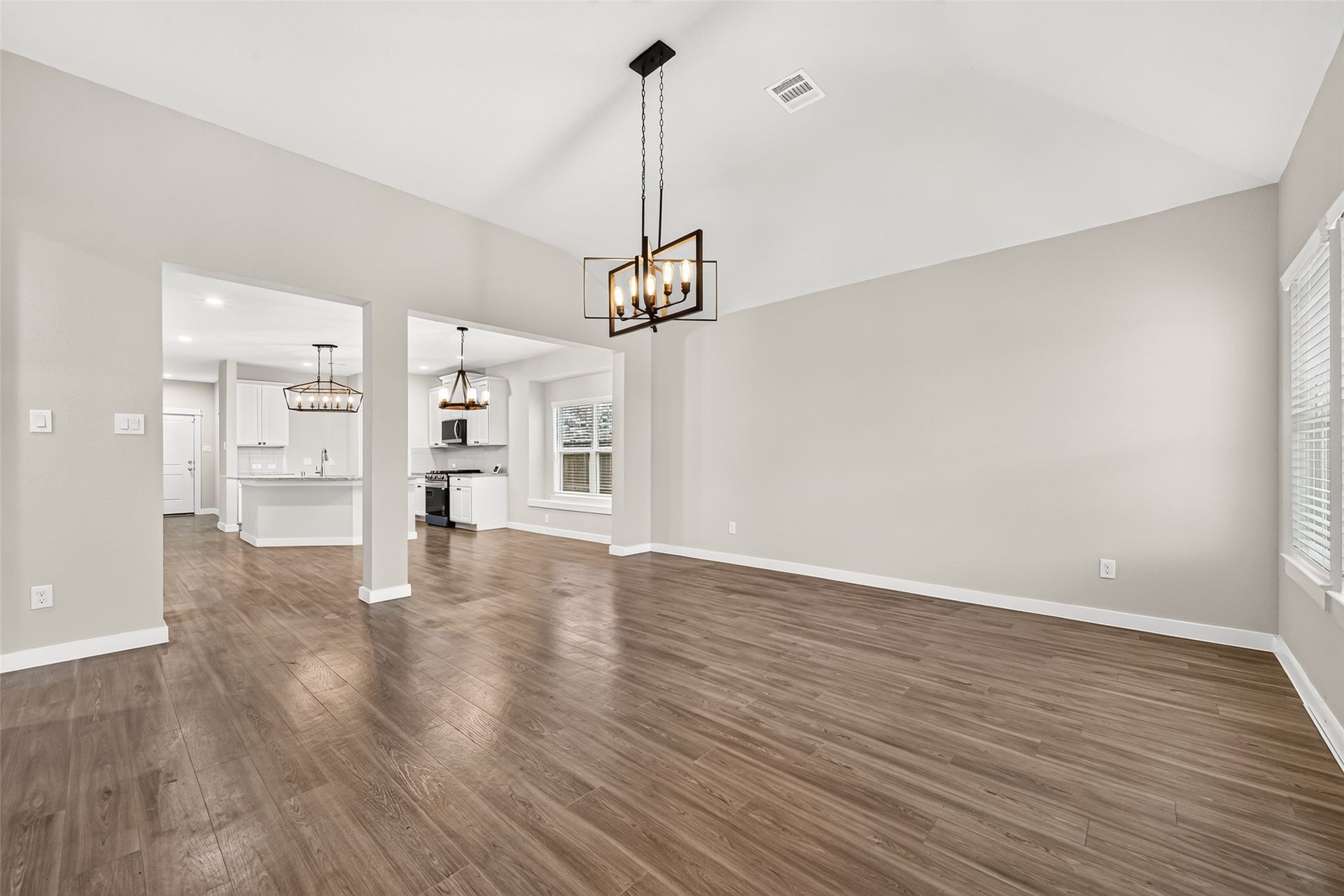 32922 Ruthie Dean Drive, Fulshear, TX 77423 The spacious family room connects to the dining area and kitchen, creating an inviting layout for everyday living and entertaining.