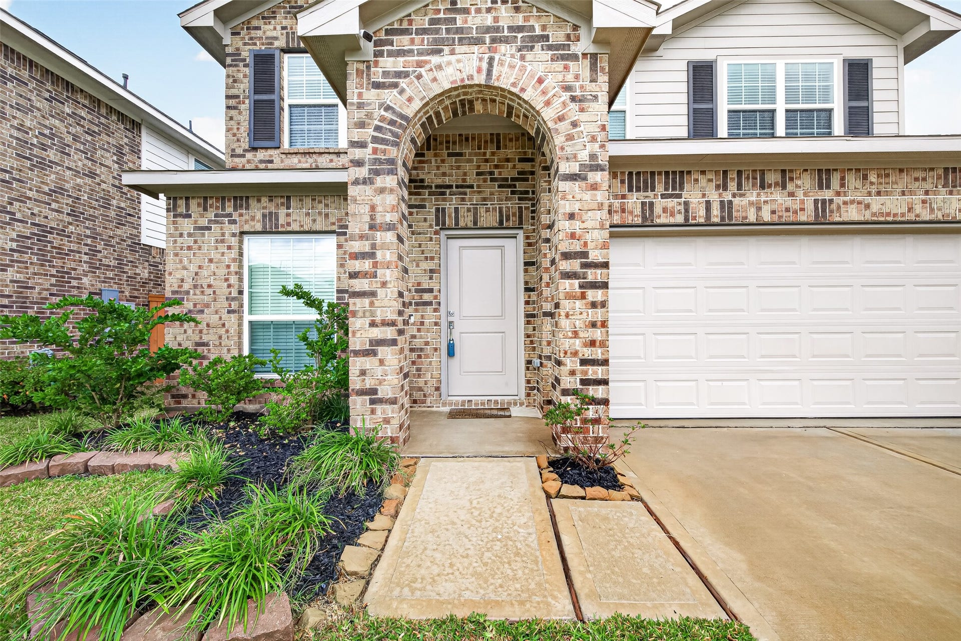 32922 Ruthie Dean Drive, Fulshear, TX 77423 The entry hallway welcomes you with neutral finishes, wood-look flooring, and convenient access to the study.