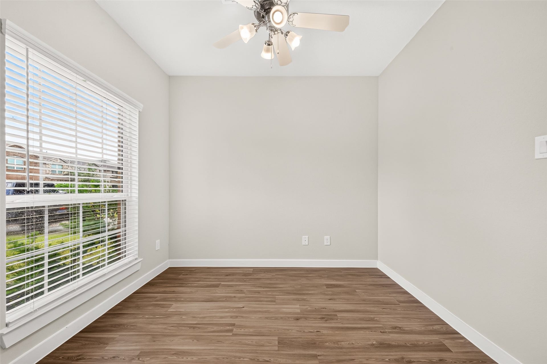 32922 Ruthie Dean Drive, Fulshear, TX 77423 Natural light and wood-look flooring make the front study a comfortable, versatile space.