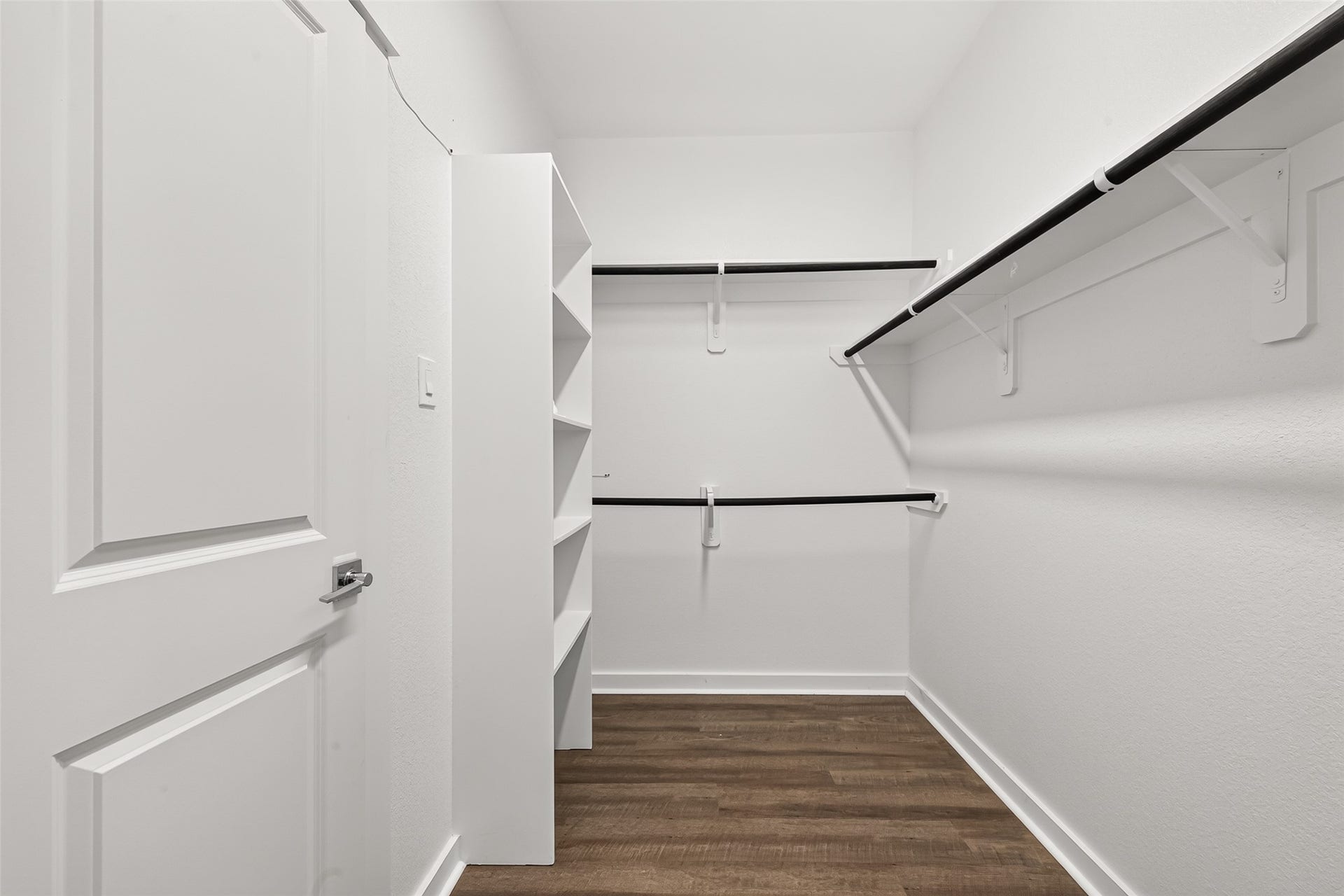 32922 Ruthie Dean Drive, Fulshear, TX 77423 The primary walk-in closet provides hanging space and shelving to help keep clothing and accessories organized.