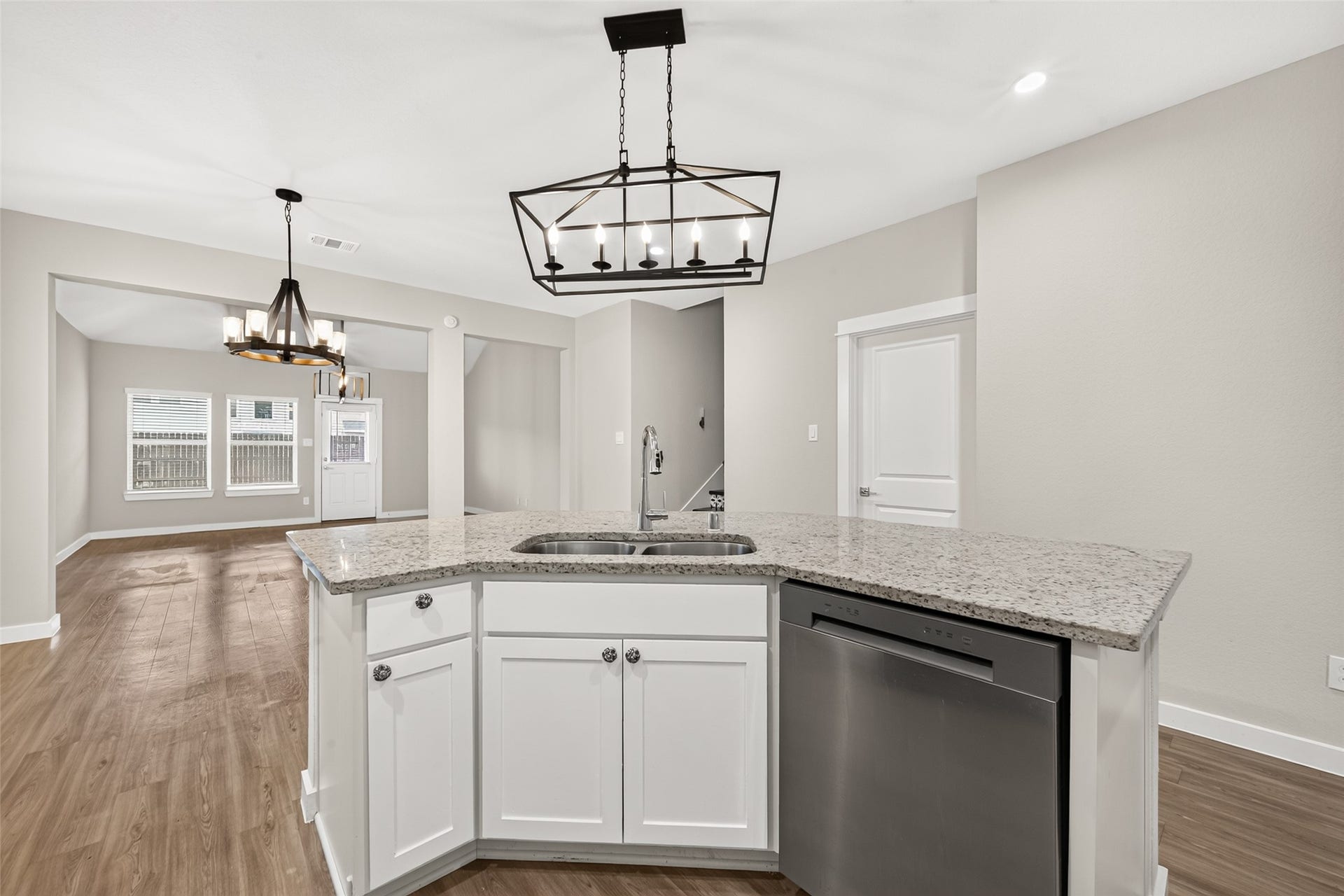32922 Ruthie Dean Drive, Fulshear, TX 77423 The kitchens breakfast bar overlooks the main living spaces, keeping the cook connected with guests.