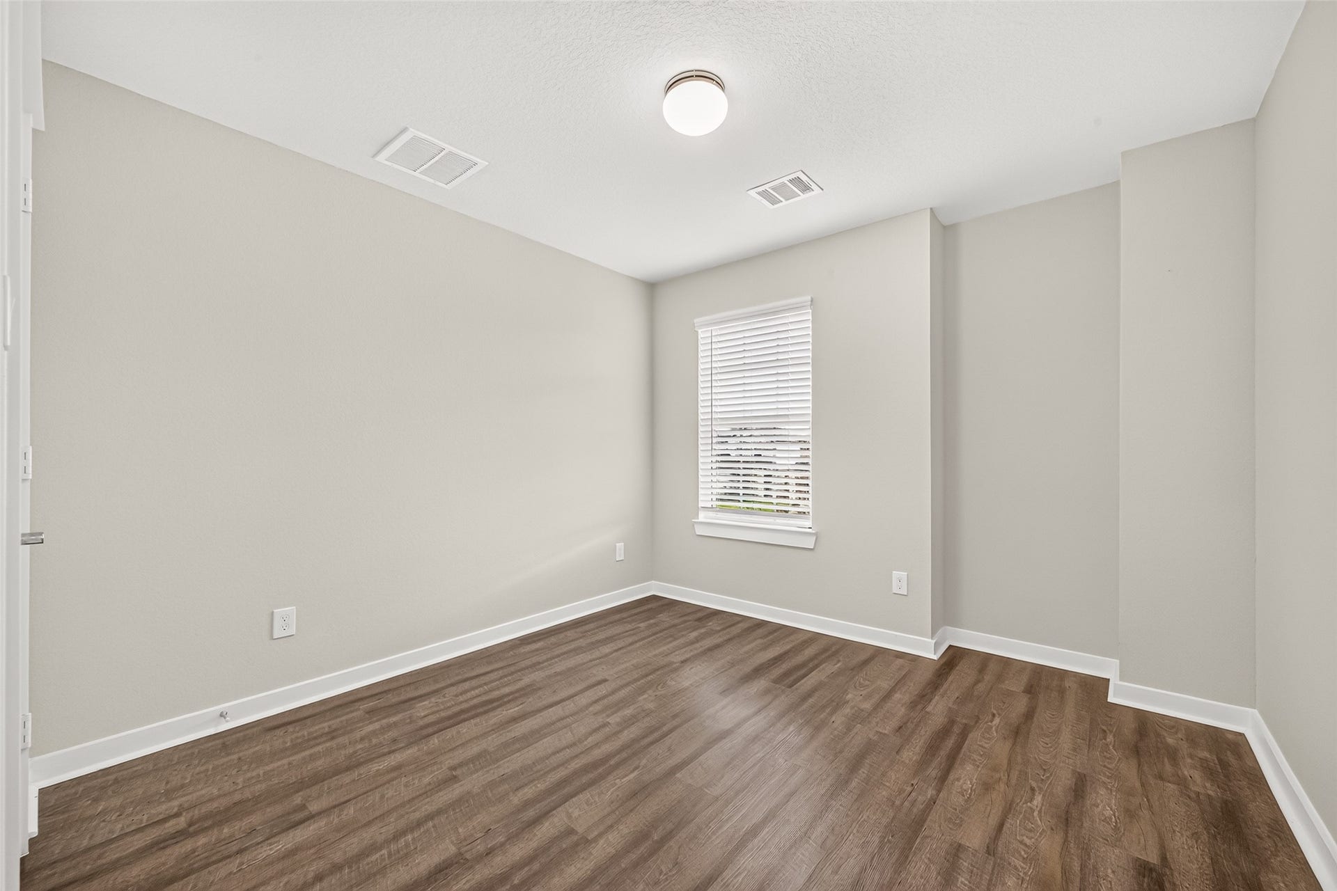 32922 Ruthie Dean Drive, Fulshear, TX 77423 The third upstairs secondary bedroom provides additional space for guests, hobbies, or everyday living.