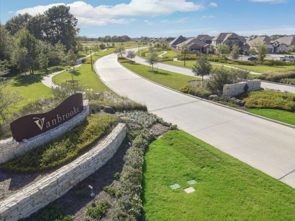 32922 Ruthie Dean Drive, Fulshear, TX 77423 The landscaped entrance welcomes you to the Vanbrooke community. Community photo.