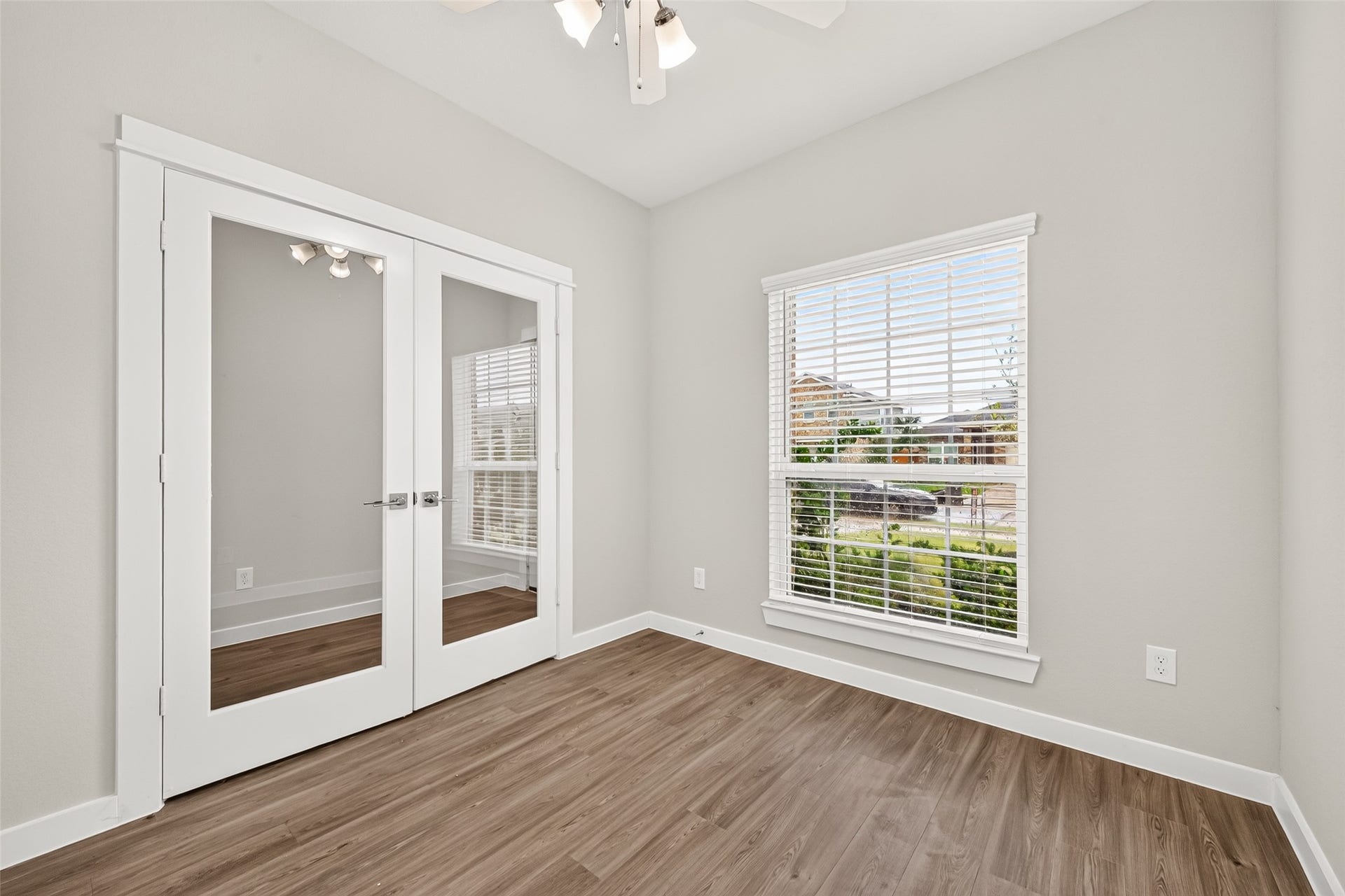 32922 Ruthie Dean Drive, Fulshear, TX 77423 Glass double doors frame the private study, offering a dedicated space for working from home, reading, or creative projects.