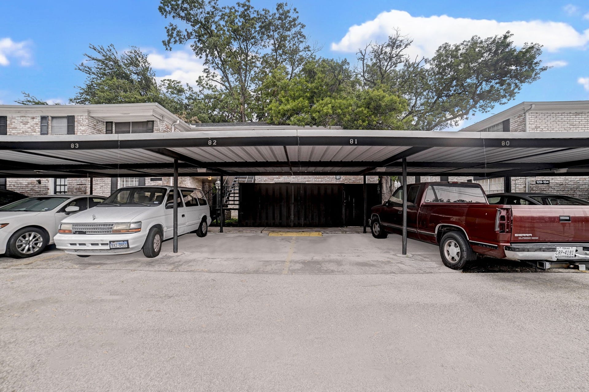7900 Westheimer Road, #202, Houston, TX 77063 Covered parking area with multiple spaces and easy access to the building, providing convenience and protection for your vehicles.