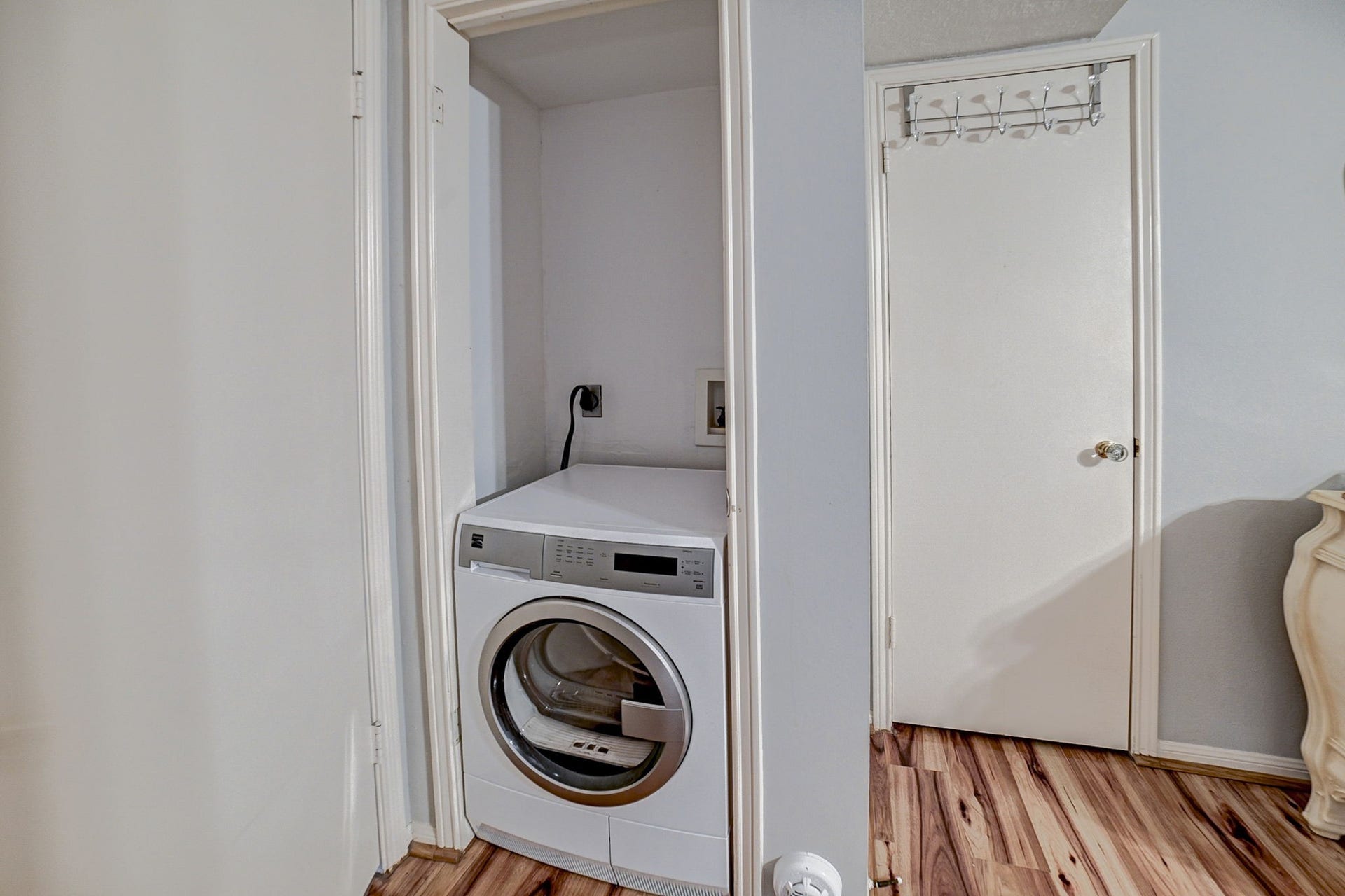 7900 Westheimer Road, #202, Houston, TX 77063 Convenient laundry nook with a modern washer and dryer set, seamlessly integrated into a compact space with easy access.