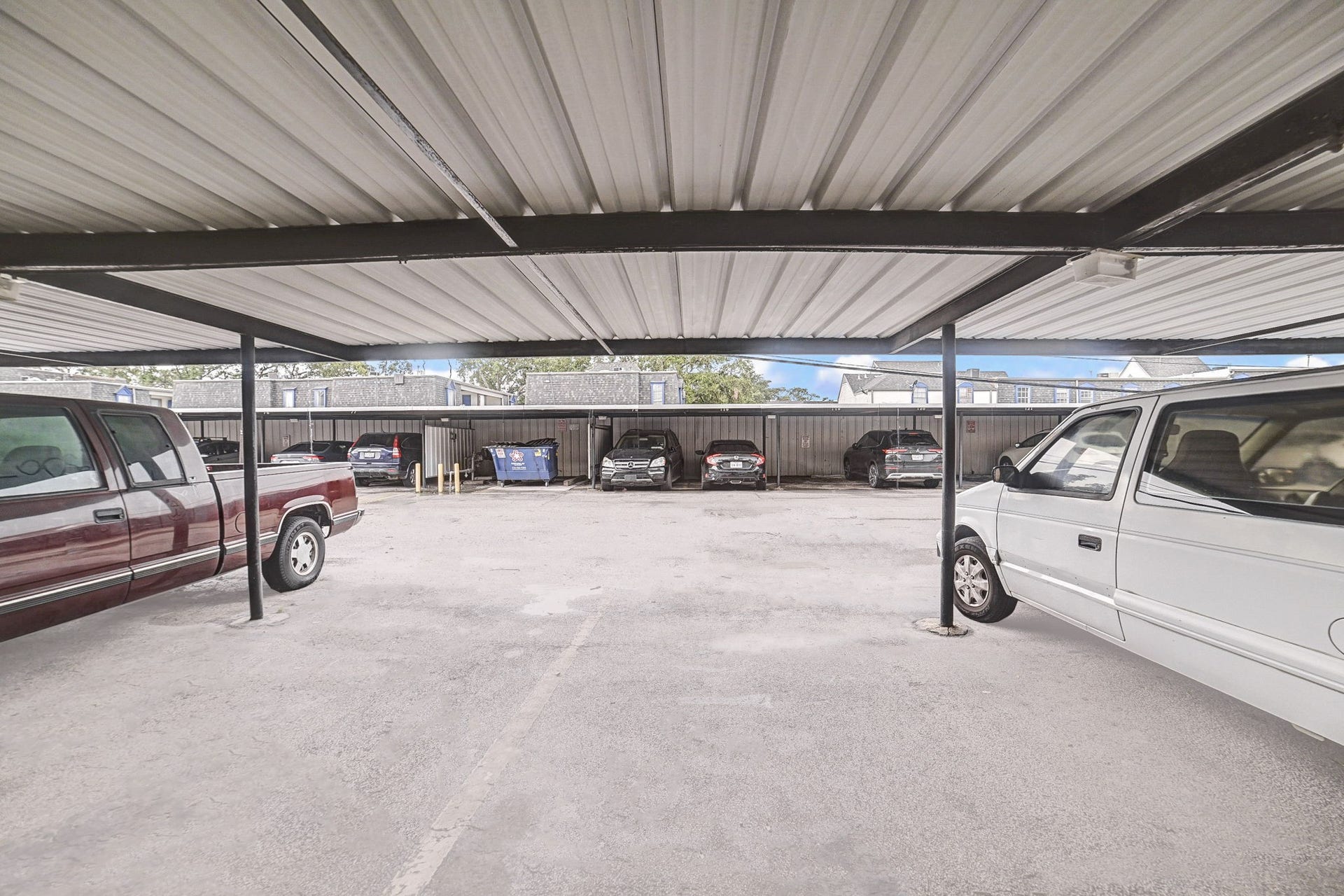 7900 Westheimer Road, #202, Houston, TX 77063 Covered parking area offering protection from the elements, accommodating multiple vehicles in a secure setting.