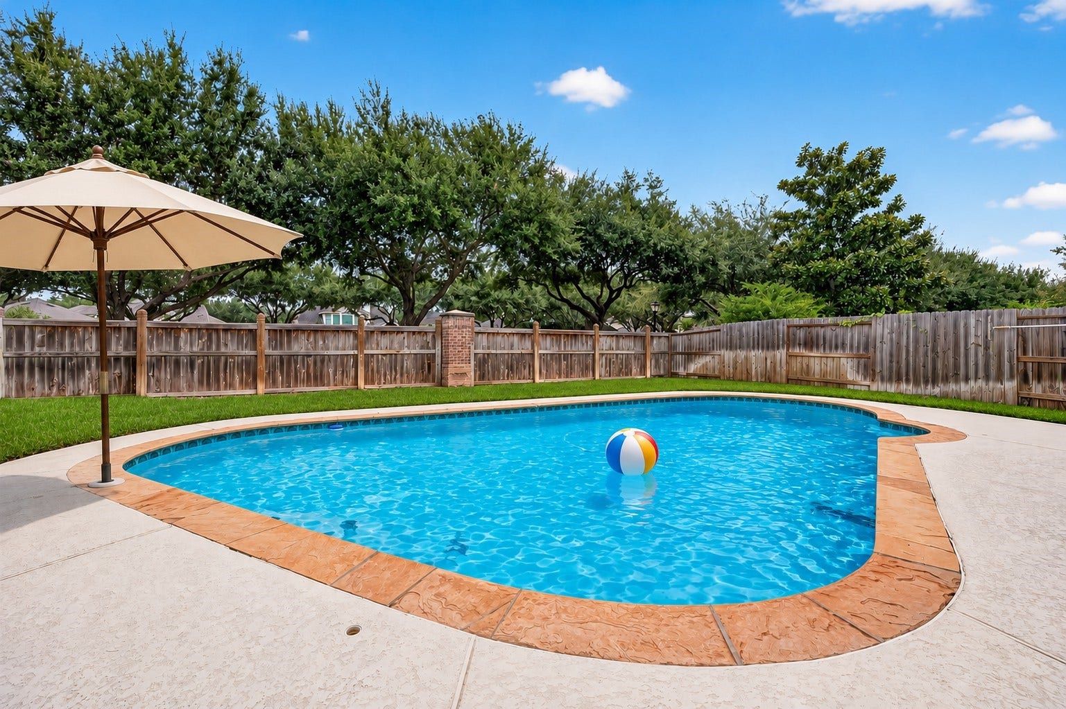 21834 Canton Pass Lane, Katy, TX 77450 Your own backyard oasis awaitsdip your toes in or make a splash while enjoying a staycation at home. With plenty of space for fun, relaxation, and entertaining, this backyard is ready to be enjoyed. **Pool umbrella & beach ball virtually staged.**