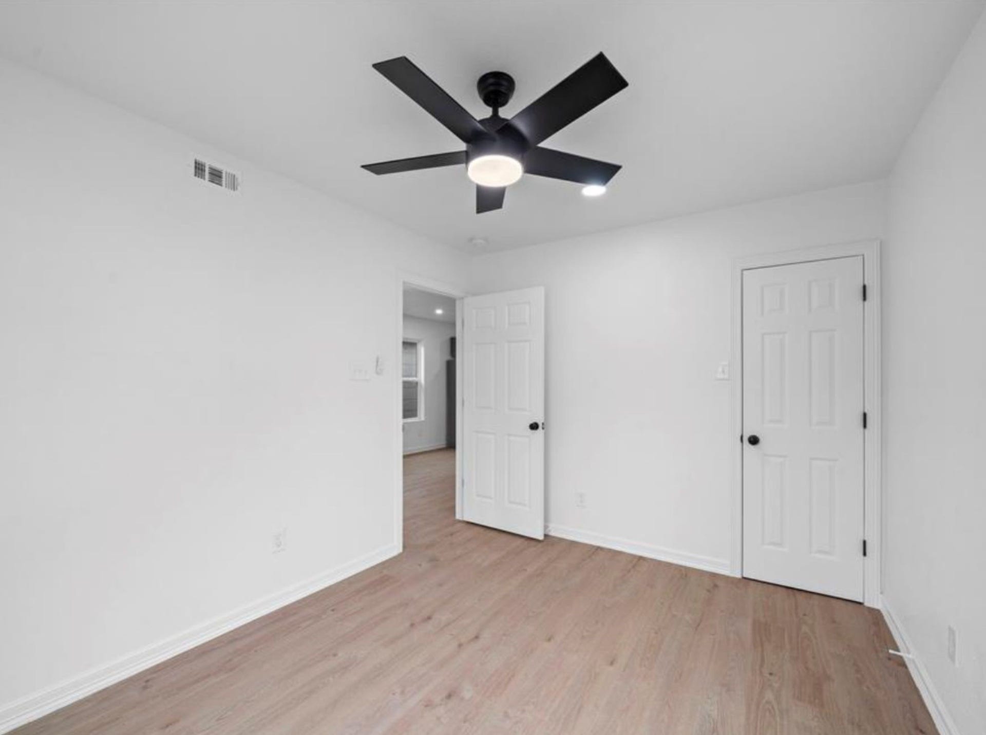 2314 Lucinda Street, Houston, TX 77004 Bedroom with ceiling fan and neutral finishes.