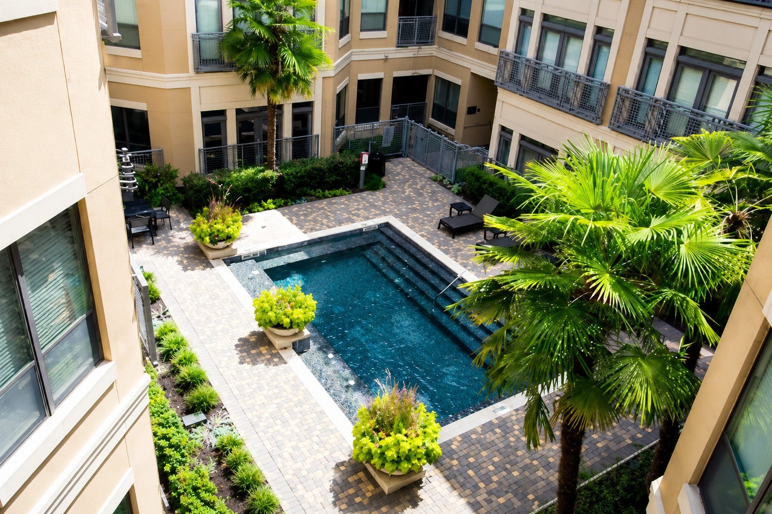 1901 Post Oak Boulevard, #3216, Houston, TX 77056 Pool view from the private covered balcony. The Lofts on Post Oak features six pools throughout the community.