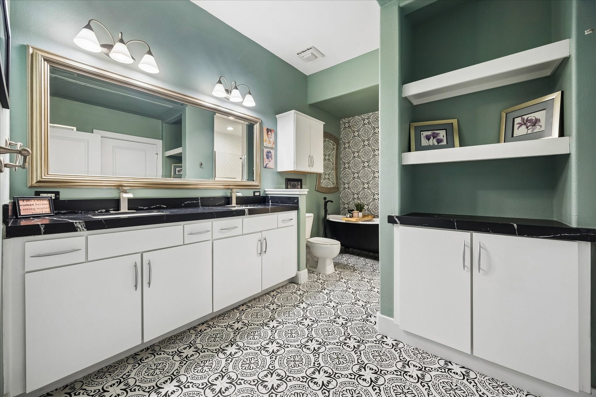 1901 Post Oak Boulevard, #3216, Houston, TX 77056 Renovated bath with leathered black quartz, double vanity, designer tile and soaking tub.