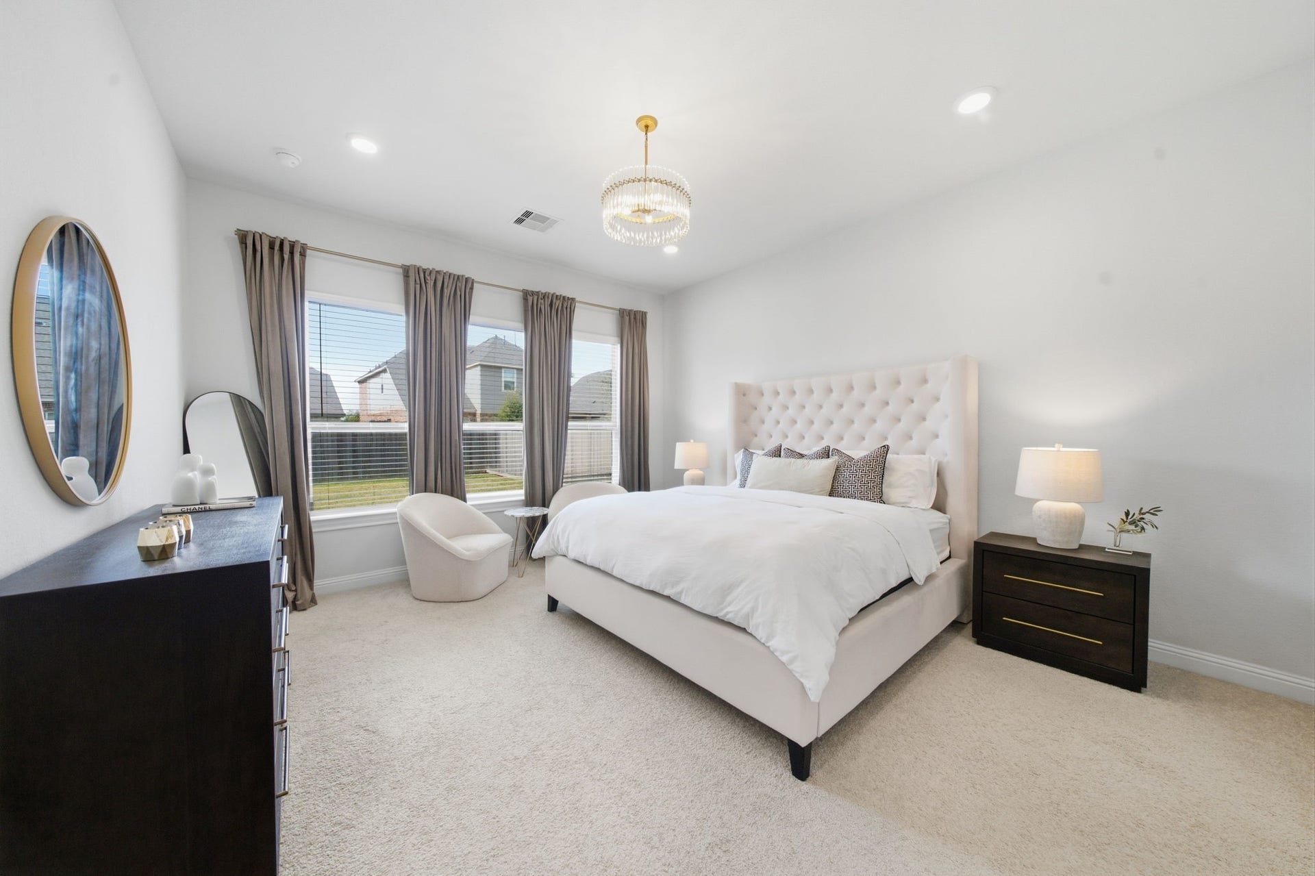 15107 Red Buckeye Drive, Cypress, TX 77433 Breathtaking custom rotunda entryway featuring a modern statement chandelier leading into the private ensuite.