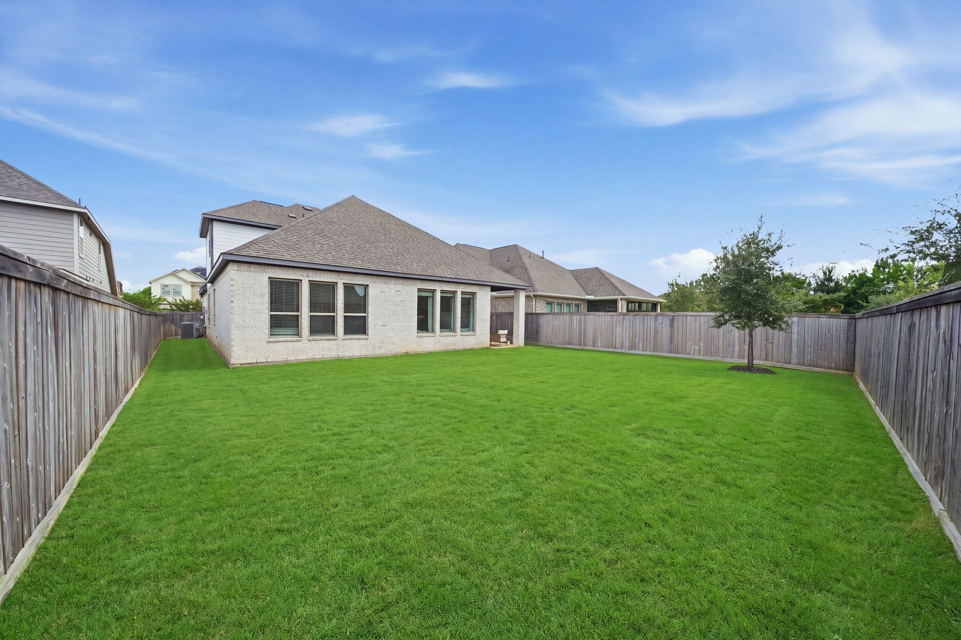 15107 Red Buckeye Drive, Cypress, TX 77433 Clean, spacious backyard paired with a covered patio - ideal for play, gardening, and making lasting memories.