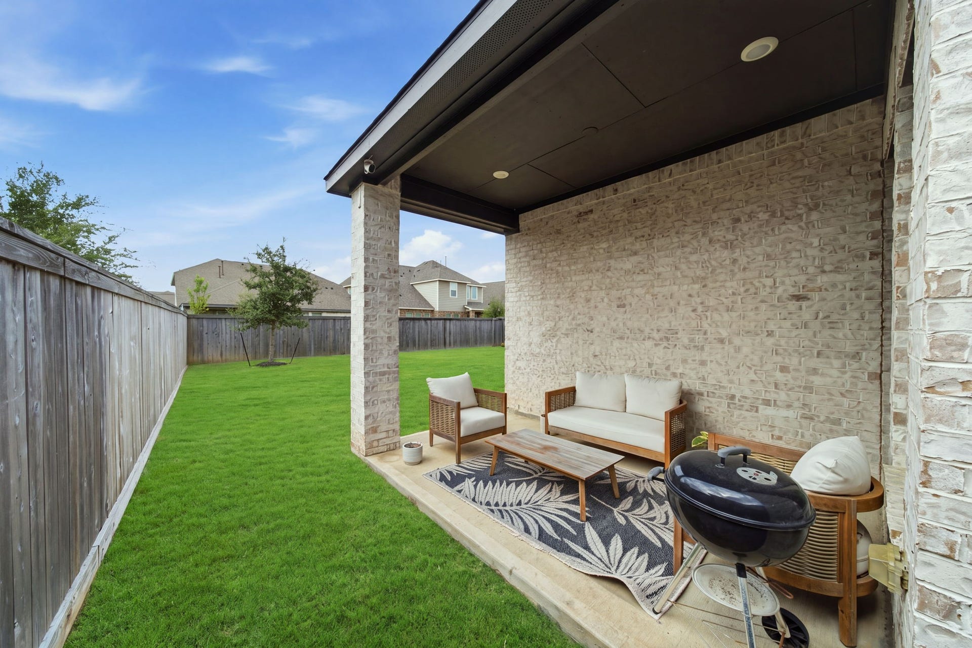 15107 Red Buckeye Drive, Cypress, TX 77433 Back patio accessible via a 36" widened door, perfect for year-round entertaining and outdoor relaxation.