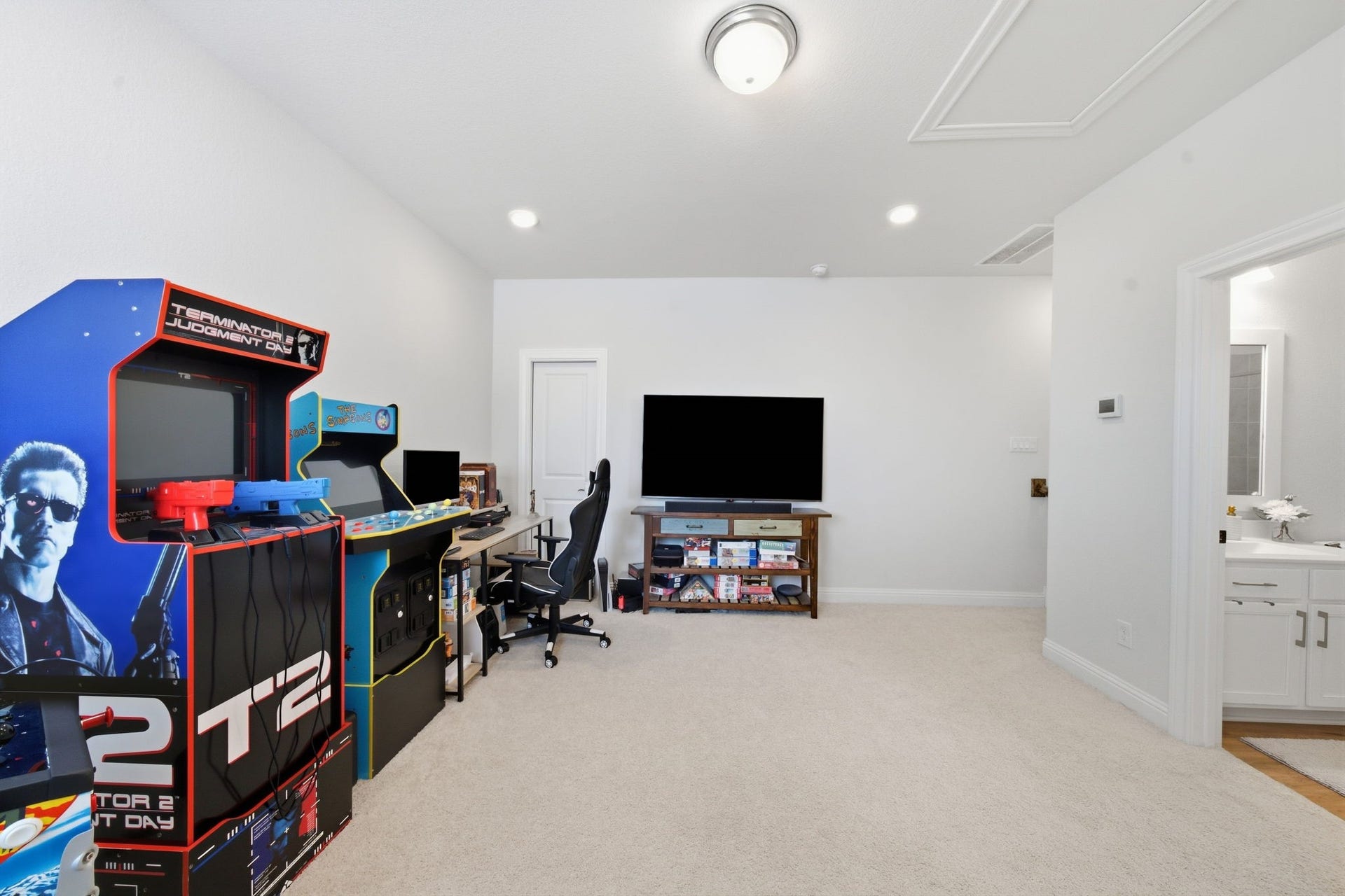 15107 Red Buckeye Drive, Cypress, TX 77433 Spacious half-story game room/loft offers the perfect secondary living area, media room, or play space.
