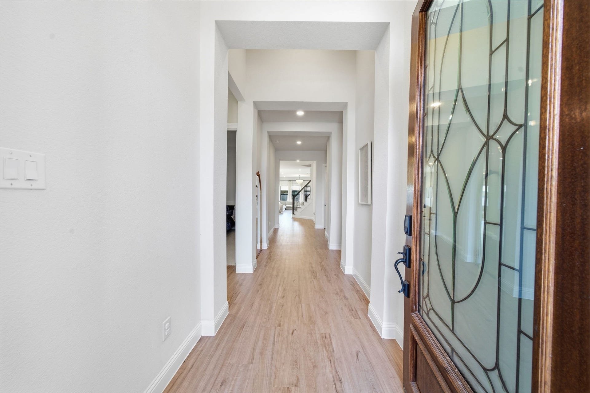 15107 Red Buckeye Drive, Cypress, TX 77433 A Grand entrance welcomes you home through a massive 8-foot front door, setting the tone for the soaring ceilings, grand architectural lines, and natural light that fill every space in the home.
