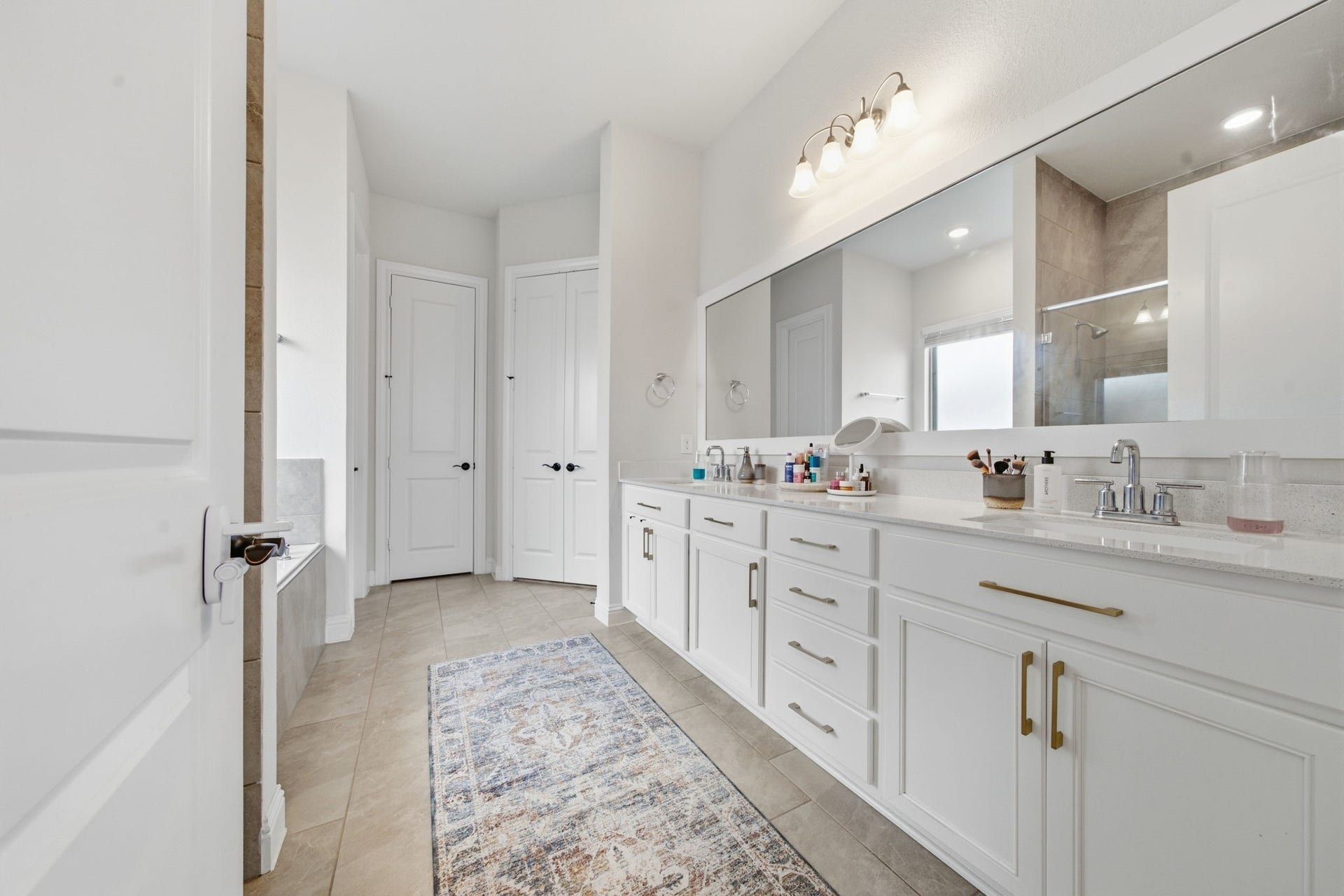 15107 Red Buckeye Drive, Cypress, TX 77433 Luxurious layout featuring dual vanity sinks, a relaxing soaking tub, and a custom separate walk-in shower.