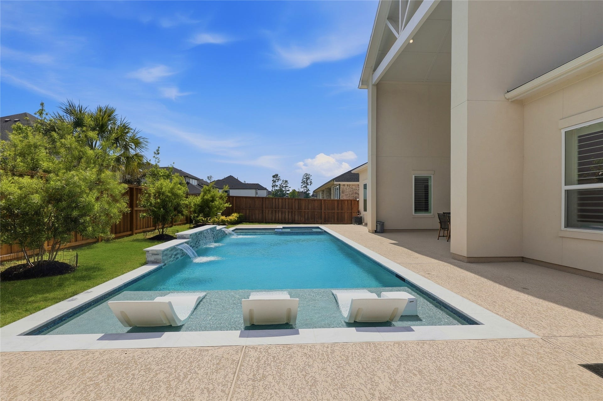 4114 Pleasant Ridge Drive, Spring, TX 77386 Sports Pool with tanning ledge and spa. This pool includes a heater and chiller!