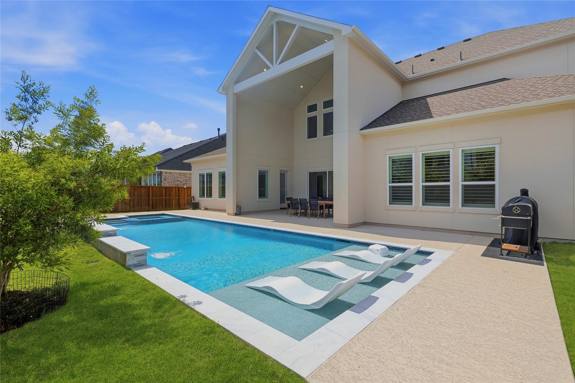 4114 Pleasant Ridge Drive, Spring, TX 77386 Sports pool with tanning ledge.