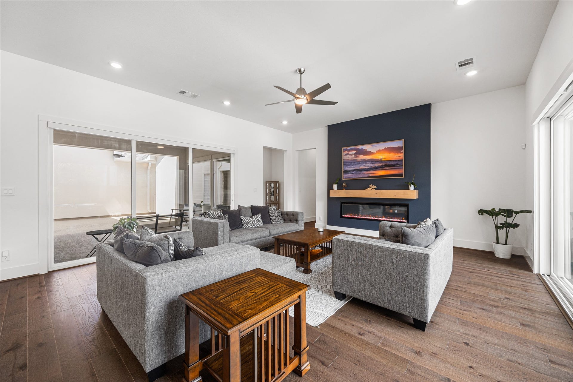 4114 Pleasant Ridge Drive, Spring, TX 77386 Both sliders open up in the main living area that is perfect for indoor/outdoor living.