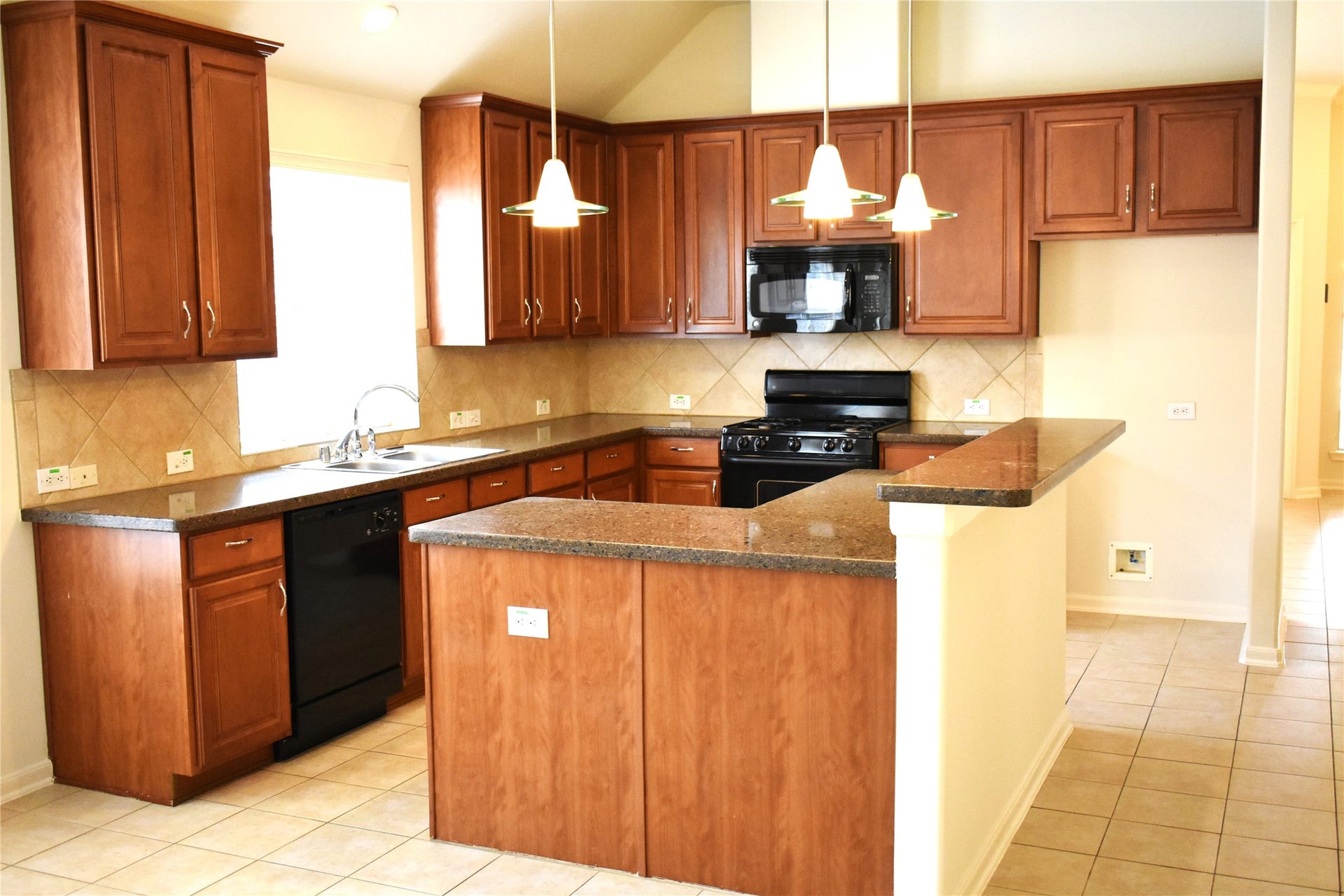 4822 Harbor Glen Lane, Houston, TX 77084 Kitchen Island features triple pennant lighting
