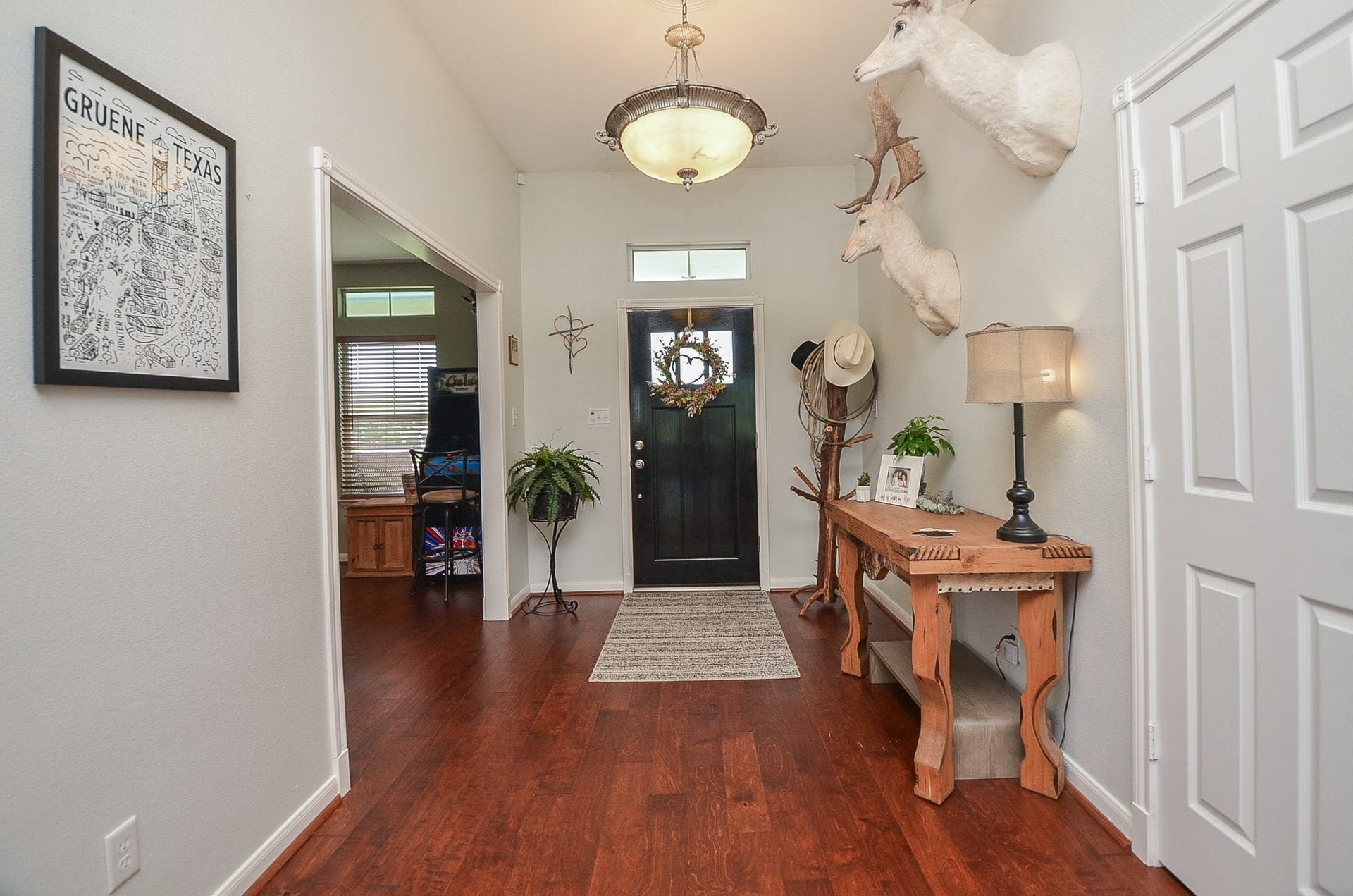27644 Spring Hill Road, Hempstead, TX 77445 Here's the alternative view, from back to front, facing the main entry, graced with cool walls and rustic flooring.