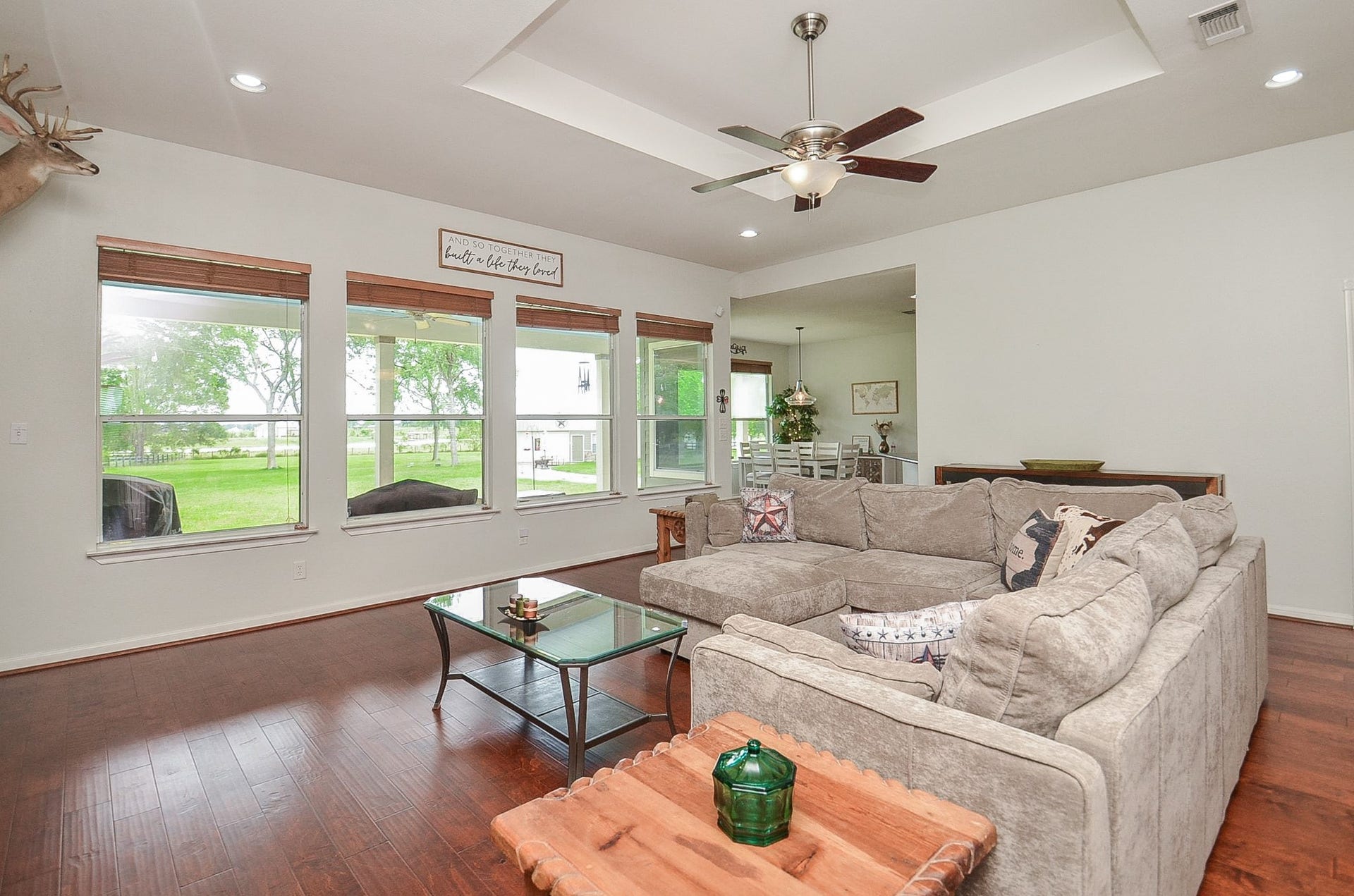 27644 Spring Hill Road, Hempstead, TX 77445 Invite green nature inside, in this view of a wall of huge windows overlooking patio and back yard from your stunning living area.