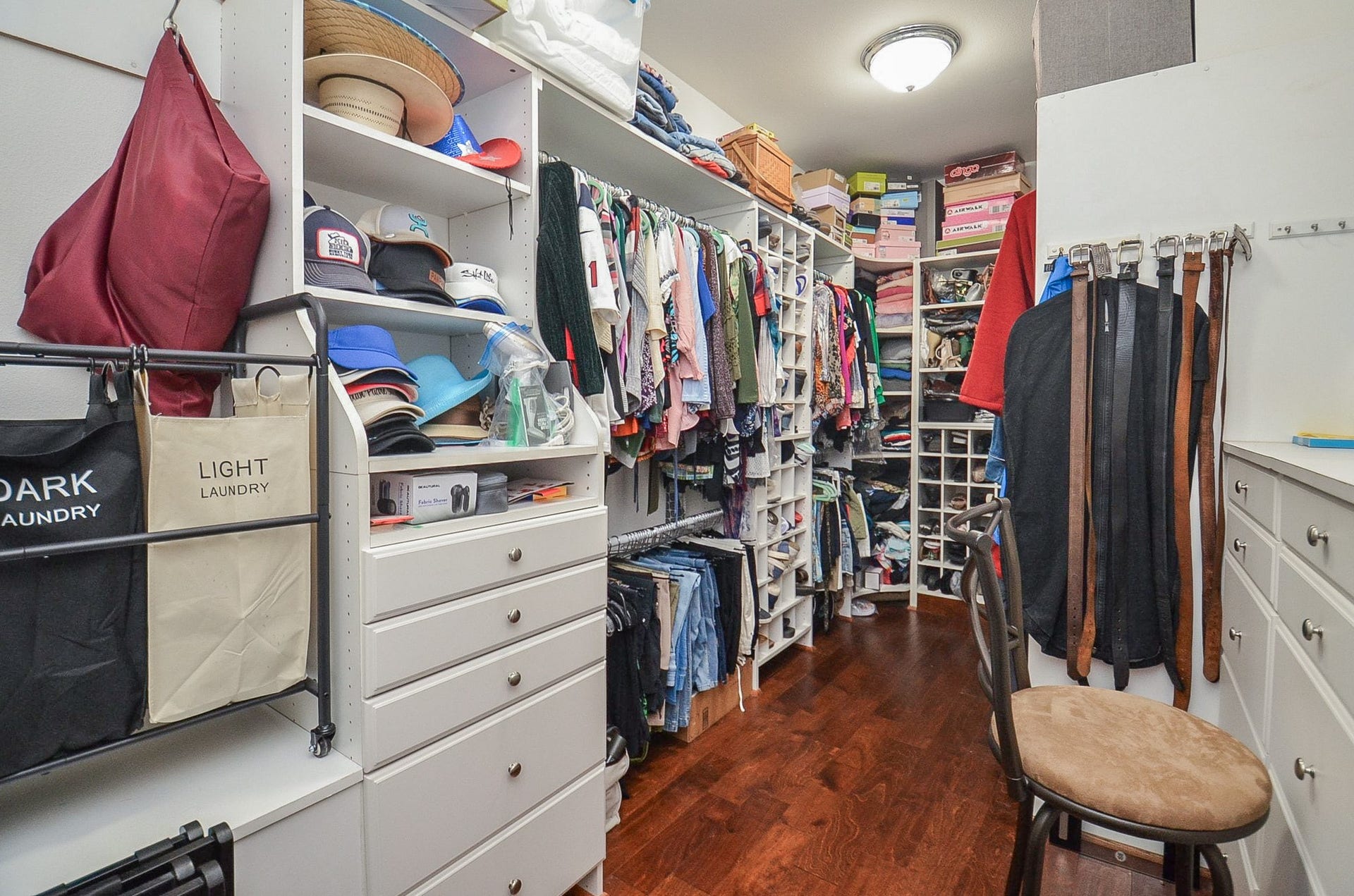 27644 Spring Hill Road, Hempstead, TX 77445 This primary walk-in closet may be mistaken for a private, cozy bedroom! Wall/floor space accommodates every hanging, organizing need!