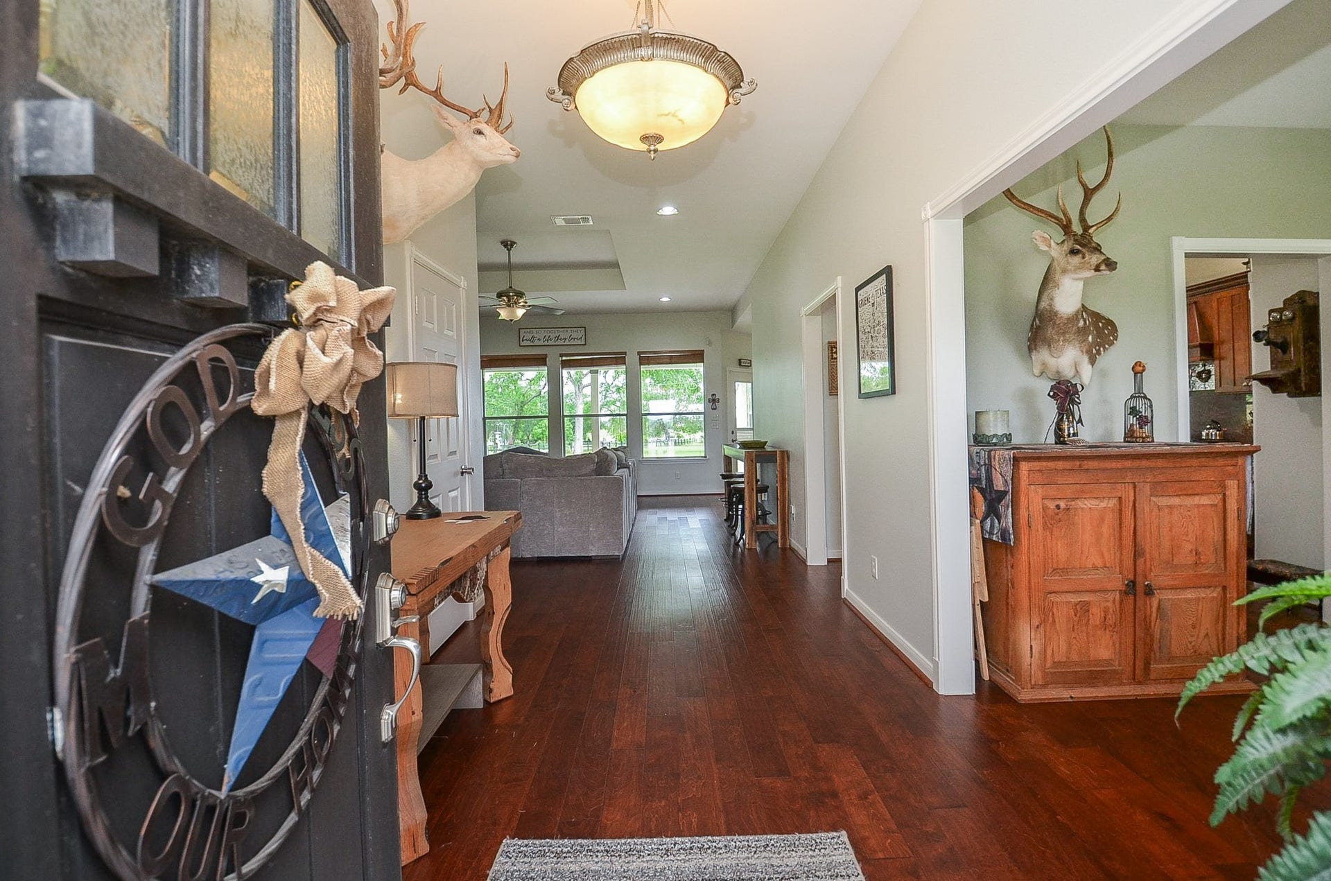 27644 Spring Hill Road, Hempstead, TX 77445 Here, at the entry to 27644 Spring Hill Road, Hempstead, TX, is a one-of-a-kind single family, single level paradise, set among nature's greenery, with blue skies above! The traditional open floor plan design concept graces this level, in this view, from front to back! At right, right off the main hallway, is a front room, with direct access to the kitchen. Inside, are 3 bedrooms and 2-1/2 baths occupying a 2.48 acre lot with 2,788 square-feet of interior space.