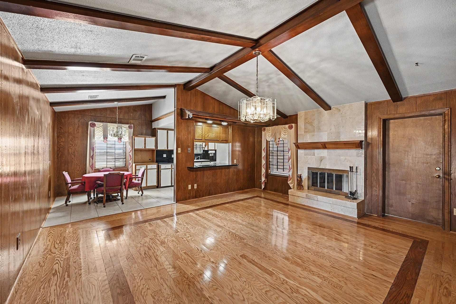 5403 Boots Road, Houston, TX 77091 Spacious living room with adjoining breakfast area and kitchen with bar seating