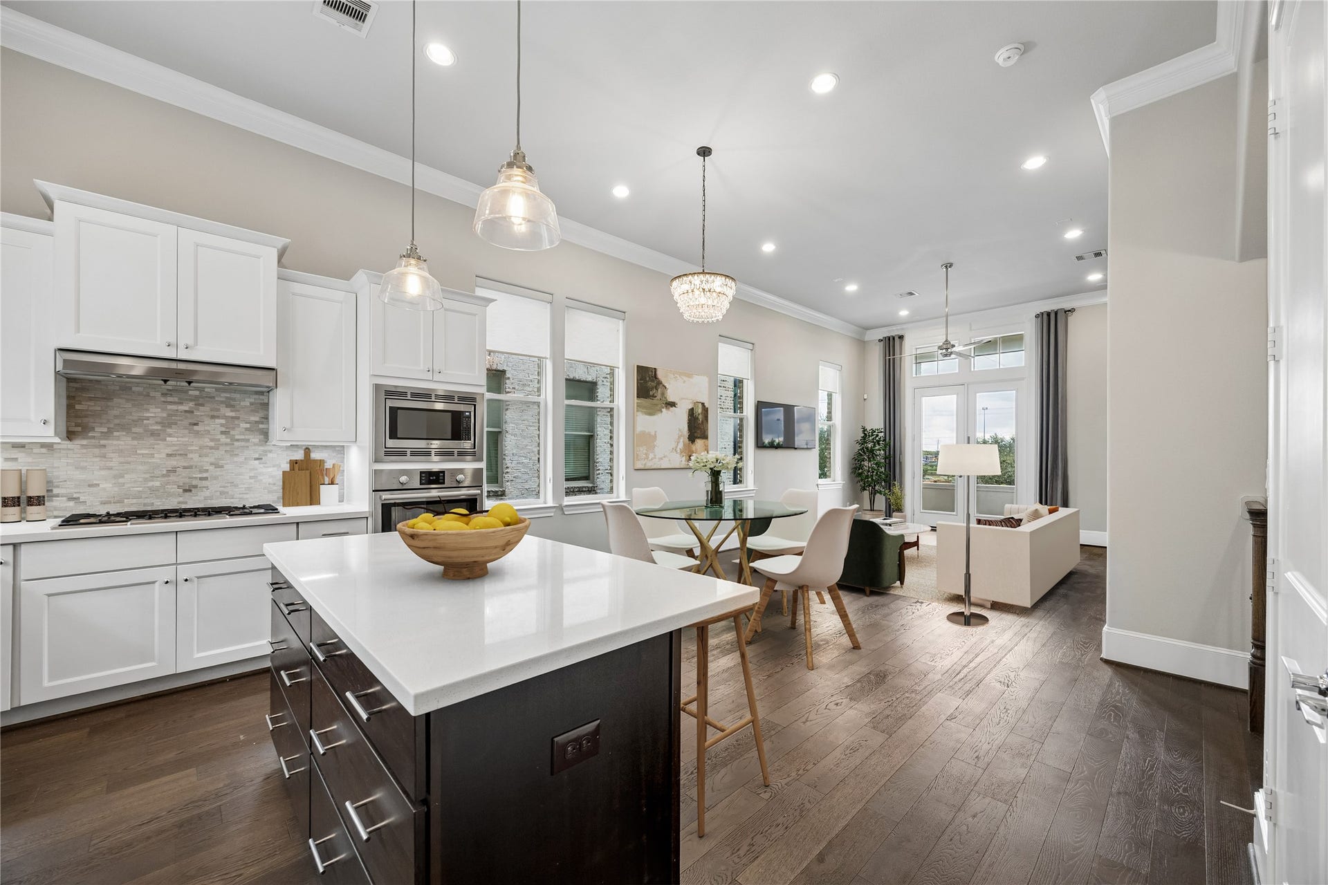 9664 Knight Road, Houston, TX 77045 Another angle of the kitchen, dining & living spaces with digital staging.