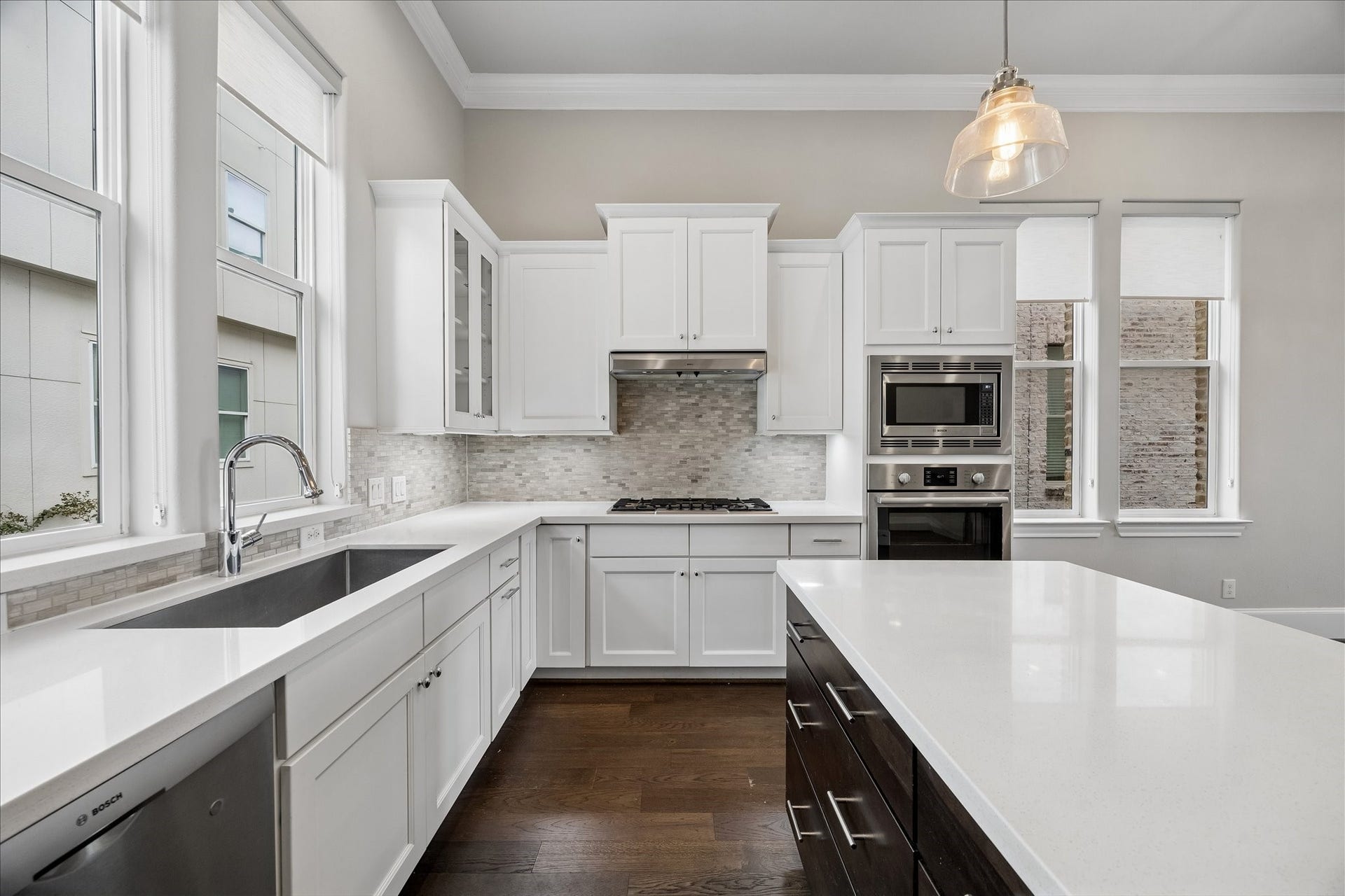 9664 Knight Road, Houston, TX 77045 A large sink beneath the windows, built-in cooktop and microwave-and-oven combination make cooking and cleanup easy. Fridge included!