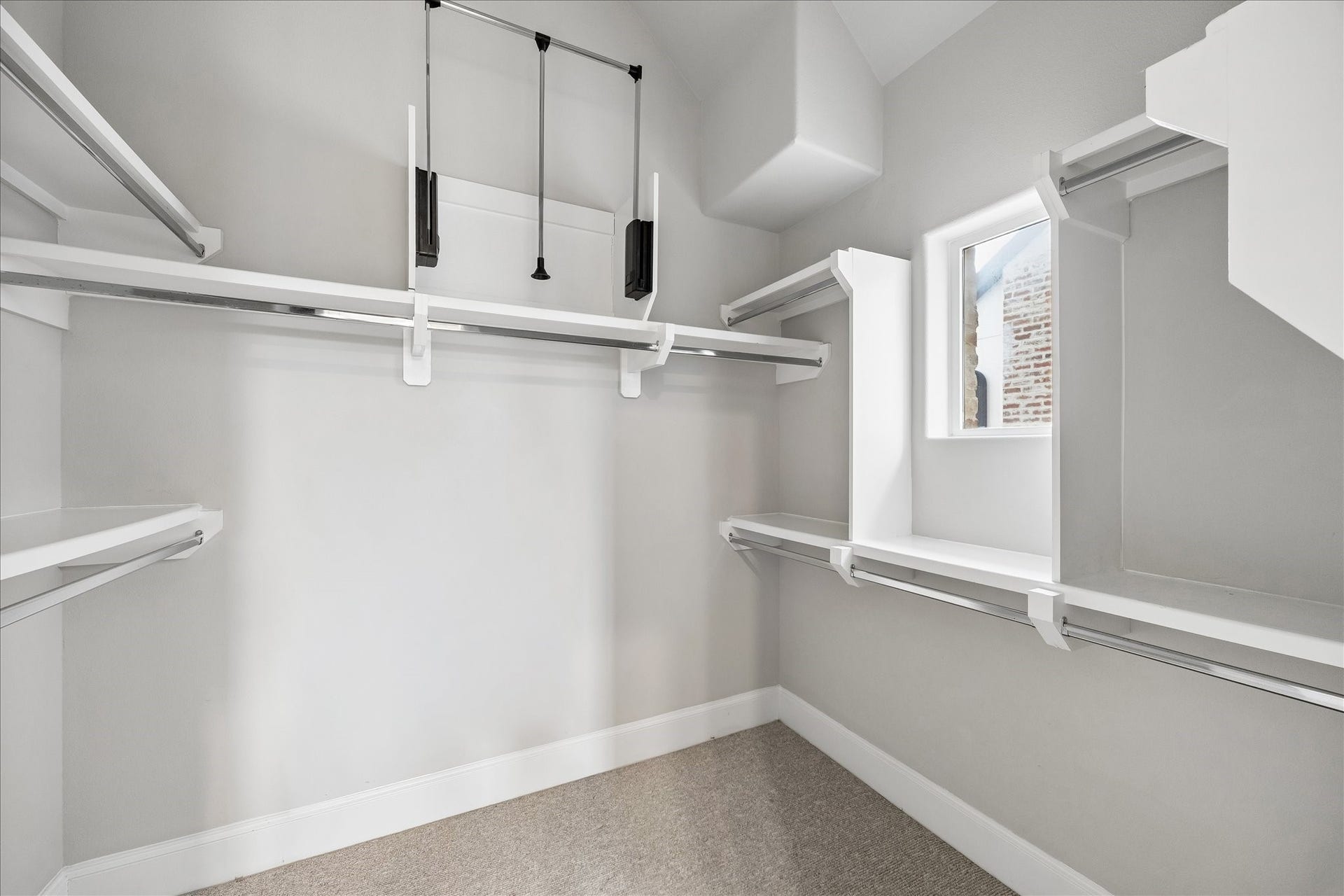 9664 Knight Road, Houston, TX 77045 The expansive walk-in closet inside the master bathroom has built-in shelves and extended upper hanging space, providing practical storage and keeping your wardrobe organized.