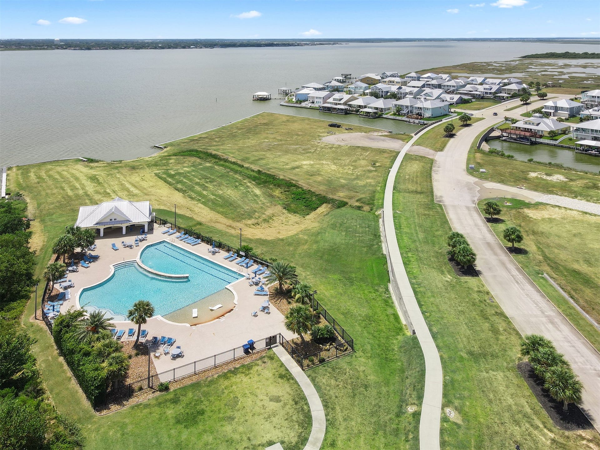 5418 Brigantine Cay Court, Texas City, TX 77590 Community pool in the foreground and boat launch in the background.