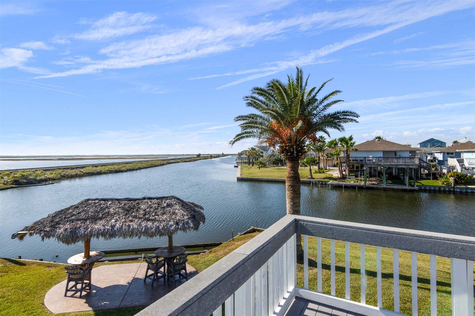 1318 Blue Heron Street, Bayou Vista, TX 77563 Beautiful palm trees and a palaypa.
