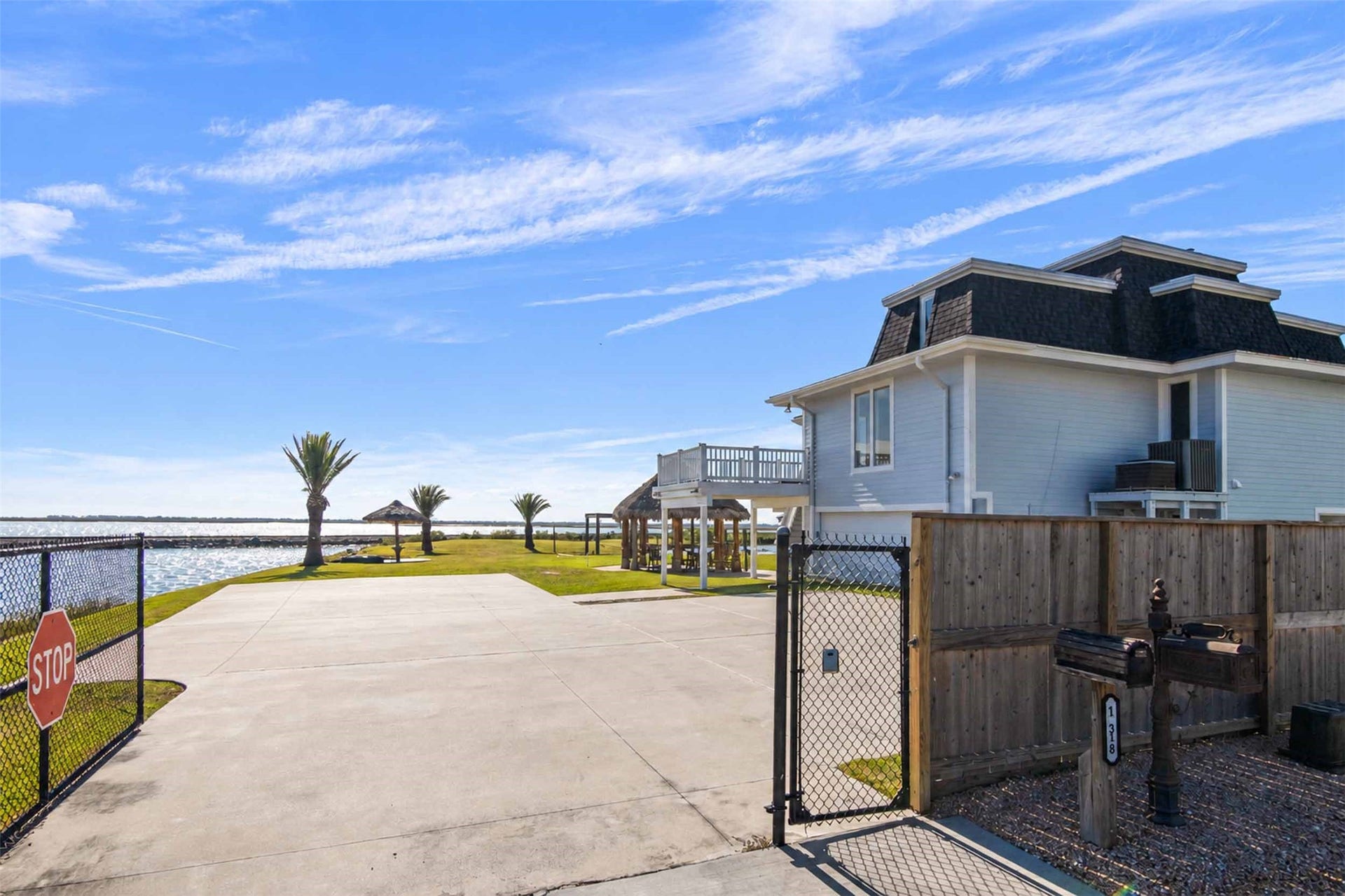 1318 Blue Heron Street, Bayou Vista, TX 77563 A private gate provides added privacy. Experience the best of coastal living in one of Bayou Vista's most distinctive waterfront properties.