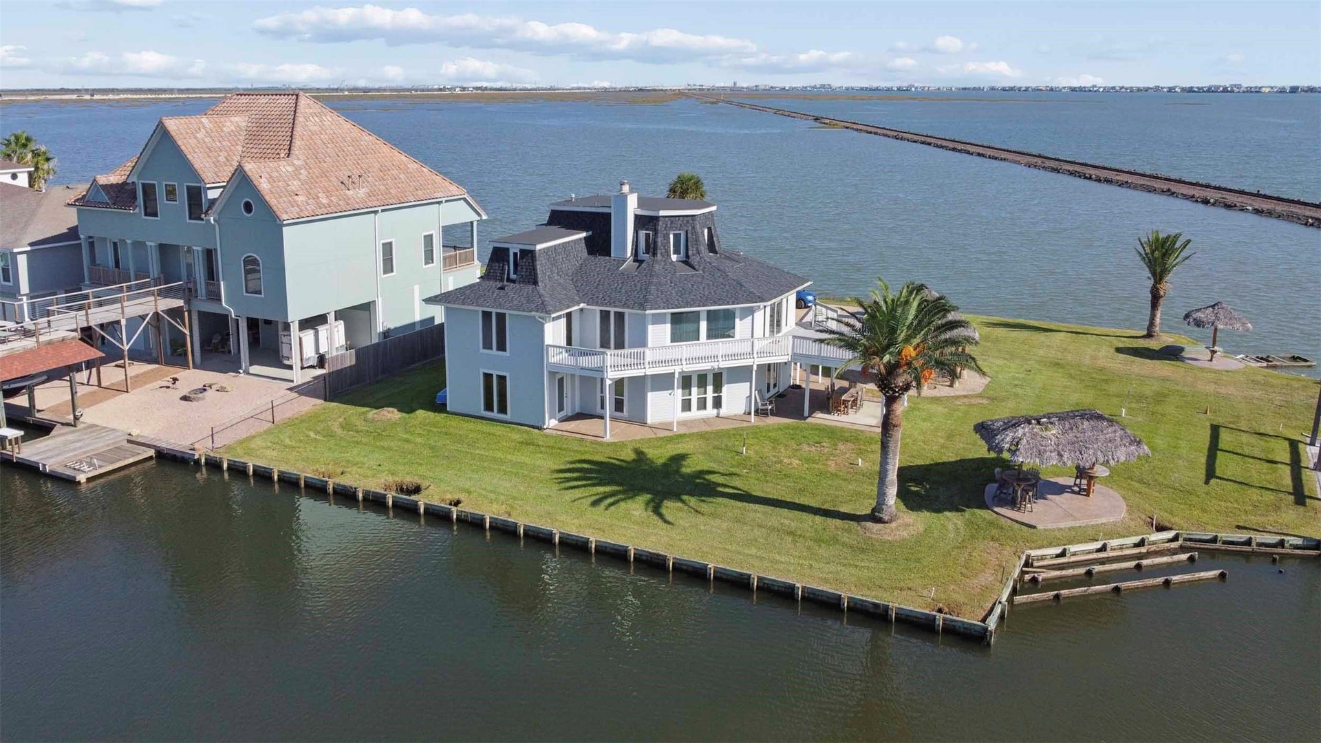 1318 Blue Heron Street, Bayou Vista, TX 77563 Primary bedroom has a deck. This extraordinary property combines spacious living, exceptional views, privacy and convenient access to the best of the Galvedton area.