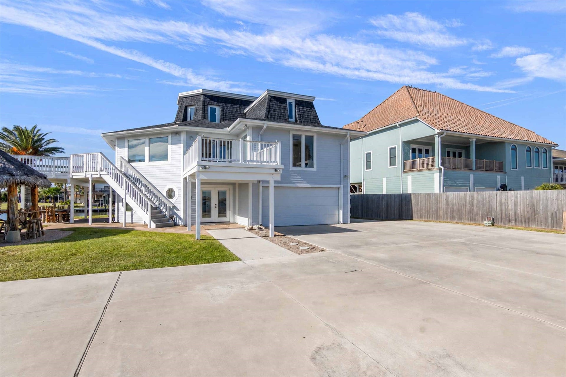 1318 Blue Heron Street, Bayou Vista, TX 77563 inside and outside stairs and 2 decks to see incredible views.