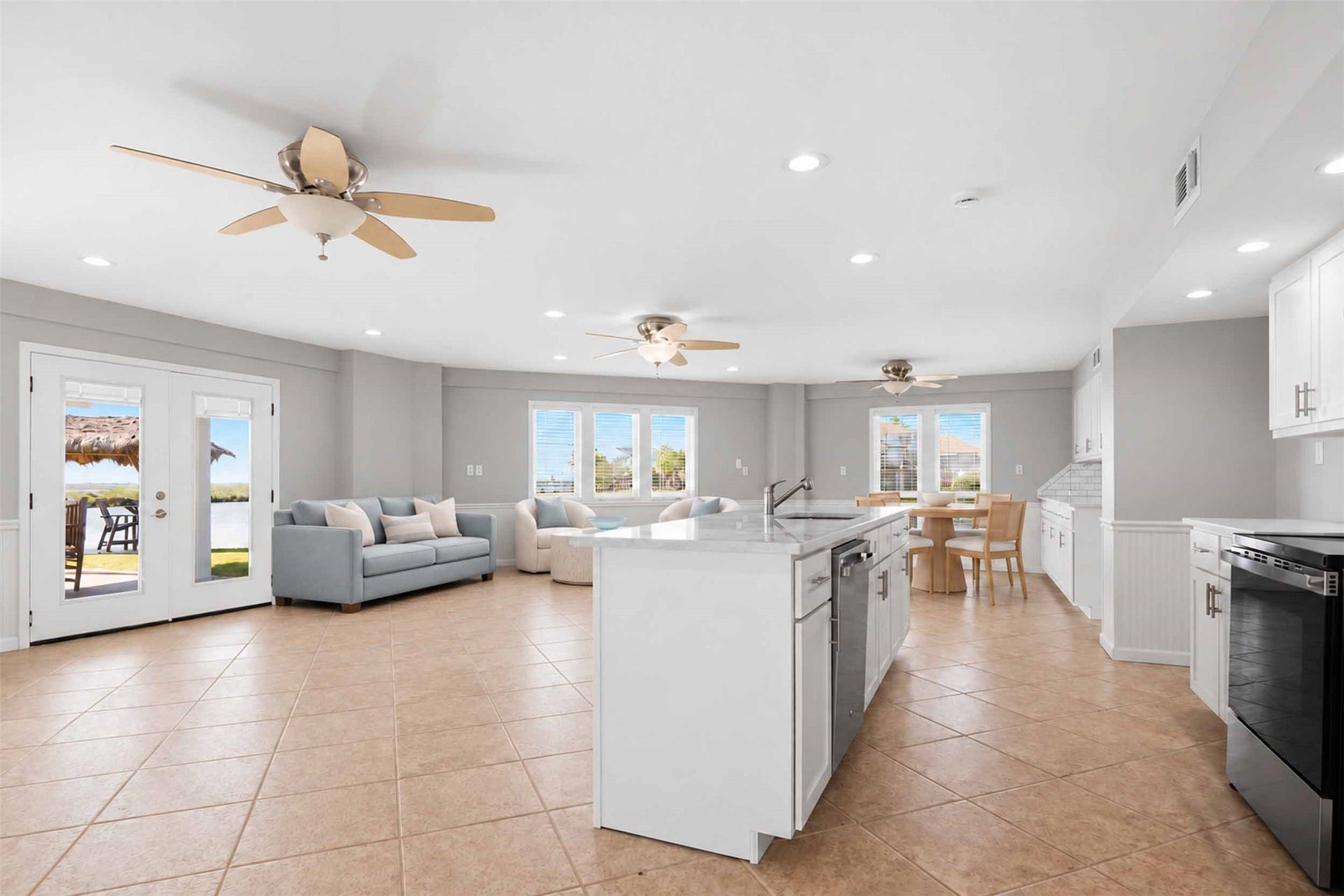 1318 Blue Heron Street, Bayou Vista, TX 77563 Updated gorgeous living room, dining room and kitchen downstairs. French doors and wall of windows.