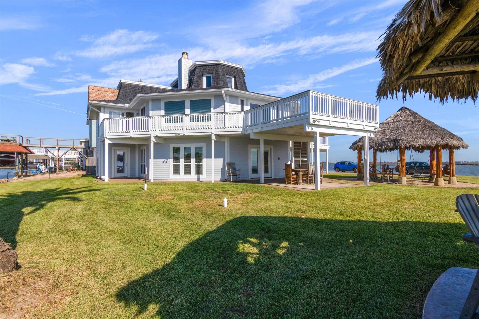 1318 Blue Heron Street, Bayou Vista, TX 77563 This home is designed for entertainment with 3 living areas,2 kitchens, 3 palapas and large decks.