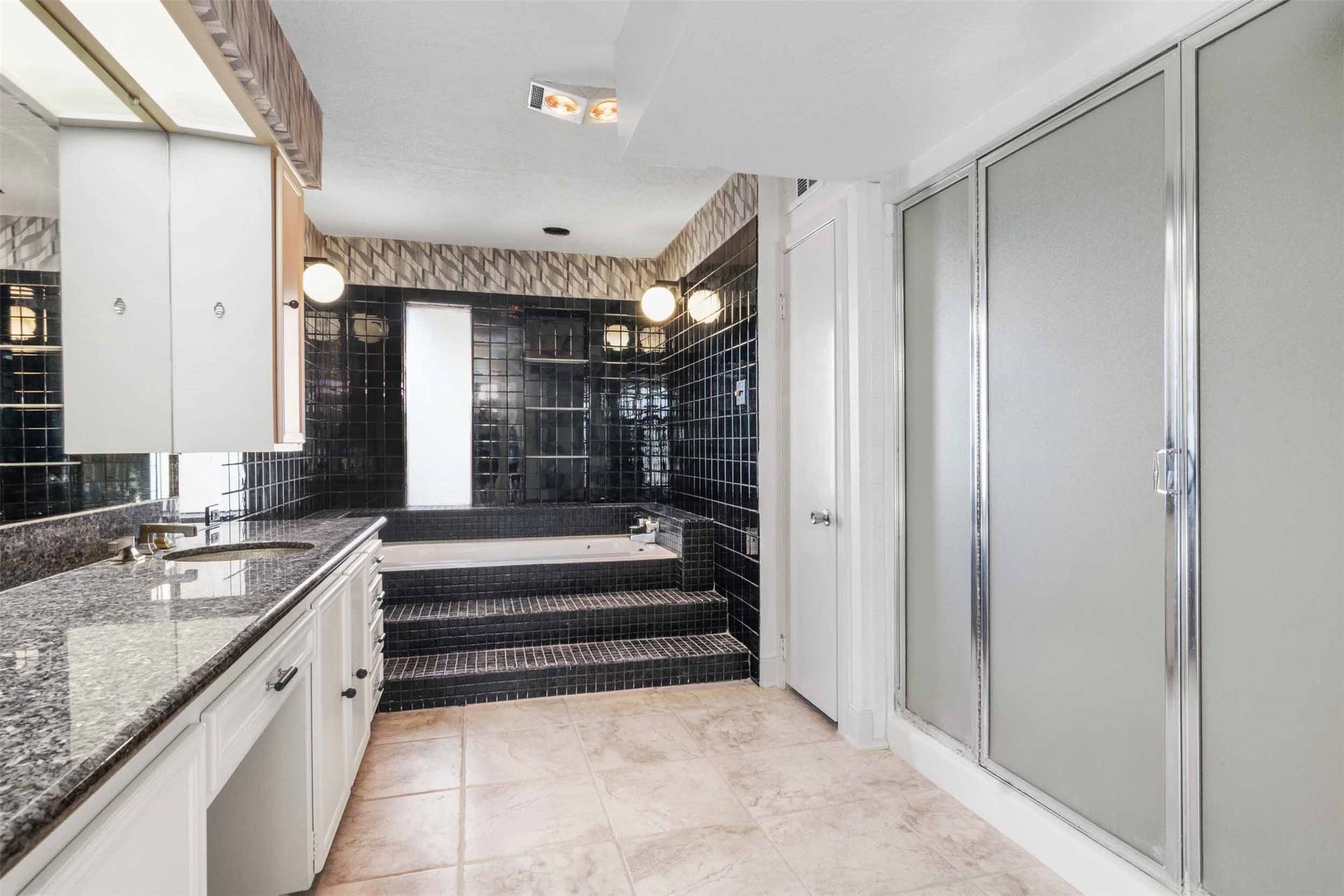 1318 Blue Heron Street, Bayou Vista, TX 77563 Elaborate primary bath with lovely tub, granite countertop, 2 sinks and large shower.