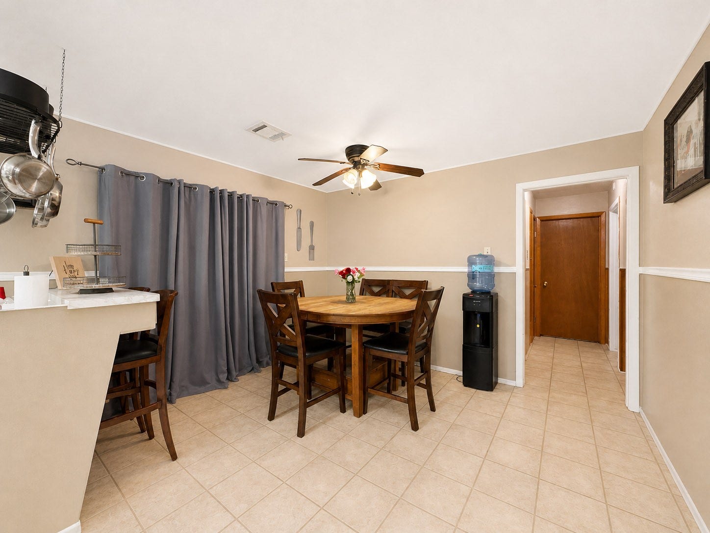 201 W 5th Street, Deer Park, TX 77536 Dining area; curtain opens to a sunroom