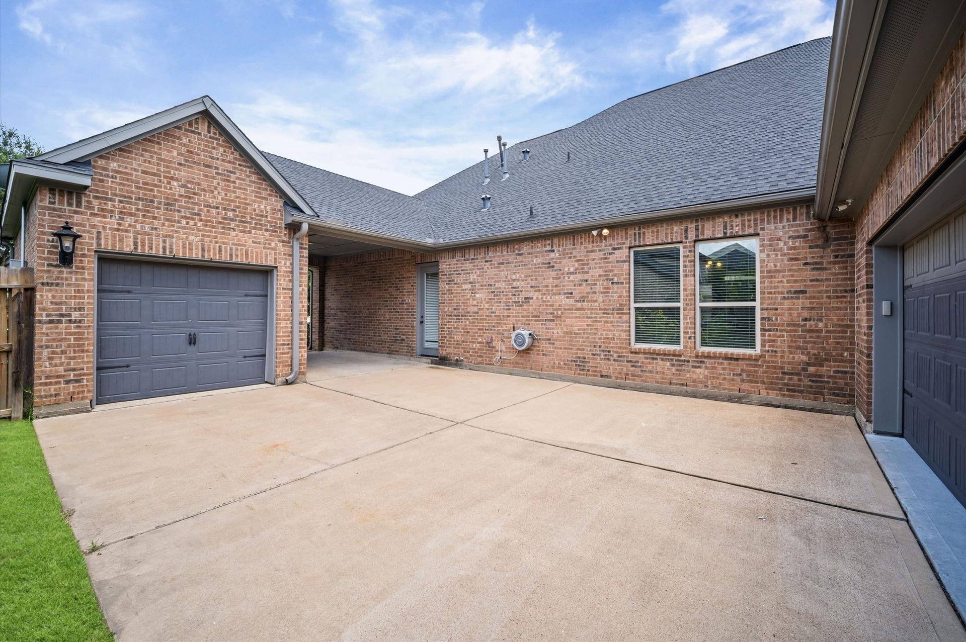 24611 Waterstone Estates Circle S, Tomball, TX 77375 The porte-cochre offers a shaded parking spot for you or a guest. As you pass through it, you'll find a two-car garage across from a single-car garage. This set up is perfect for boat owners, golf carts, or a workshop.